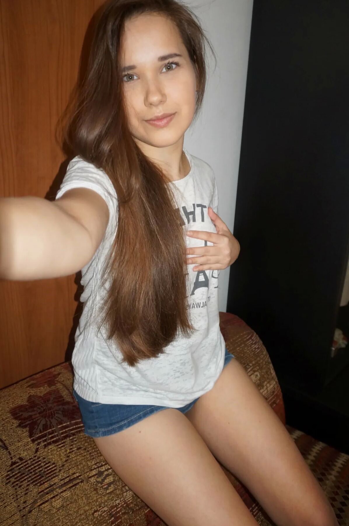 Long-haired teen loves to pose and take nudes