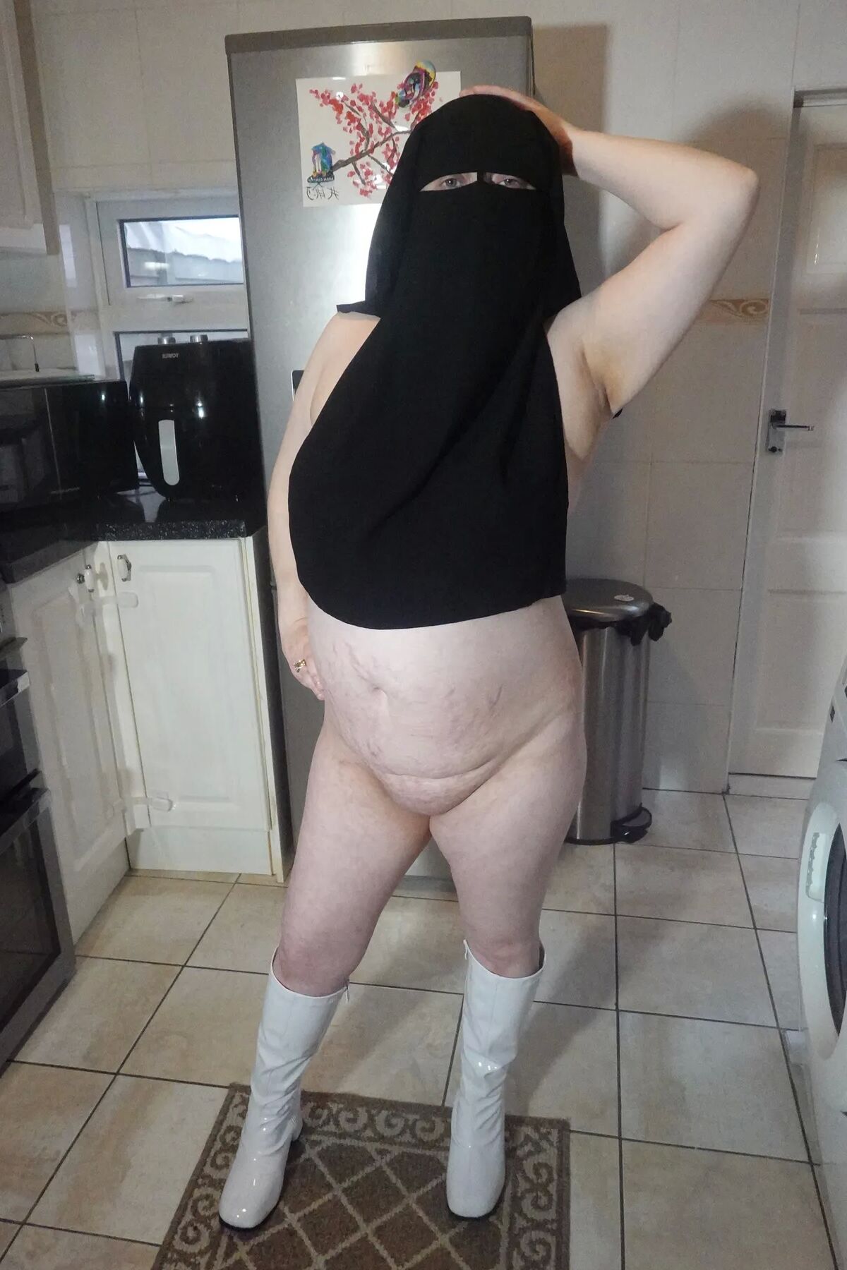 Naked in Niqab and white Knee Boots