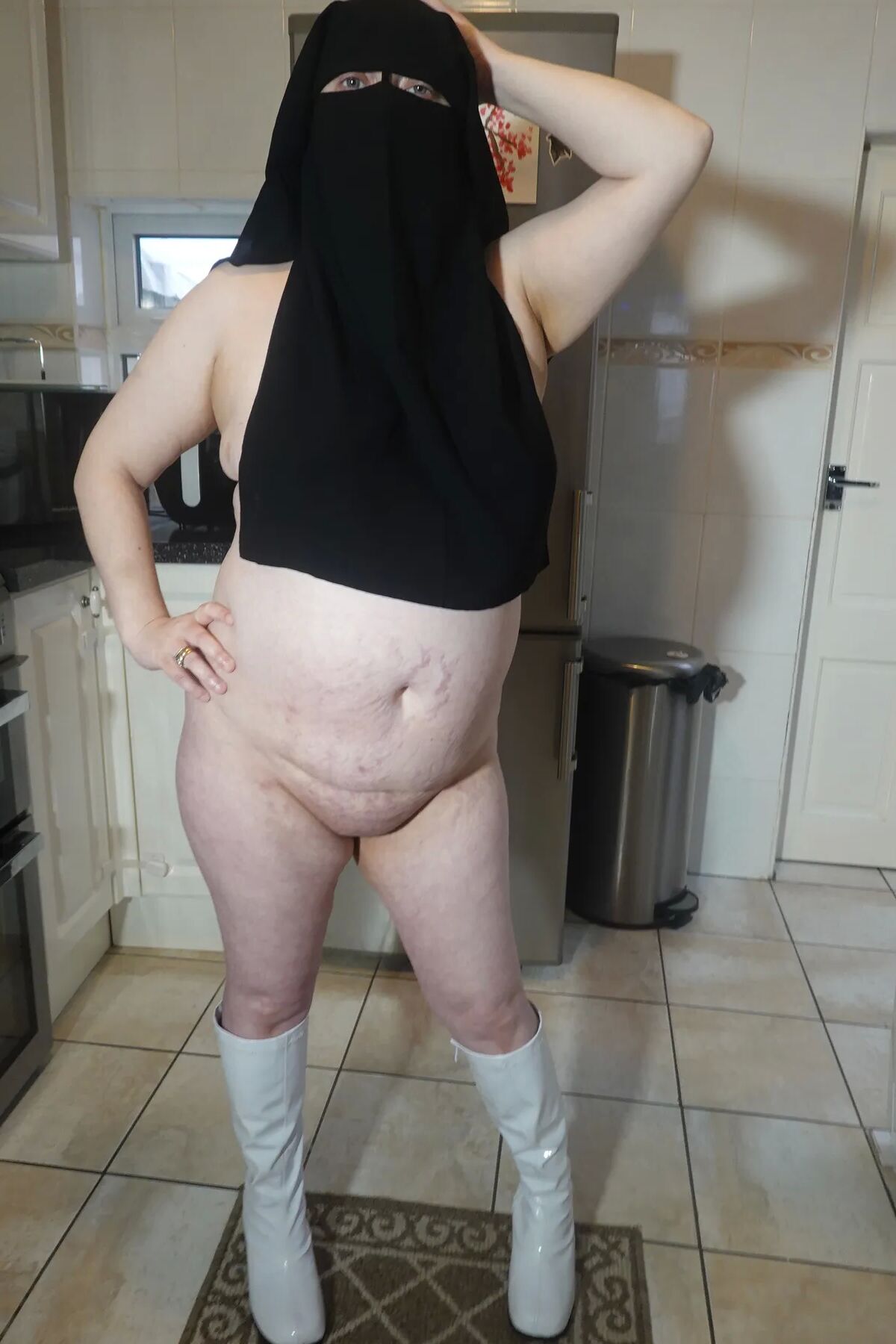 Naked in Niqab and white Knee Boots