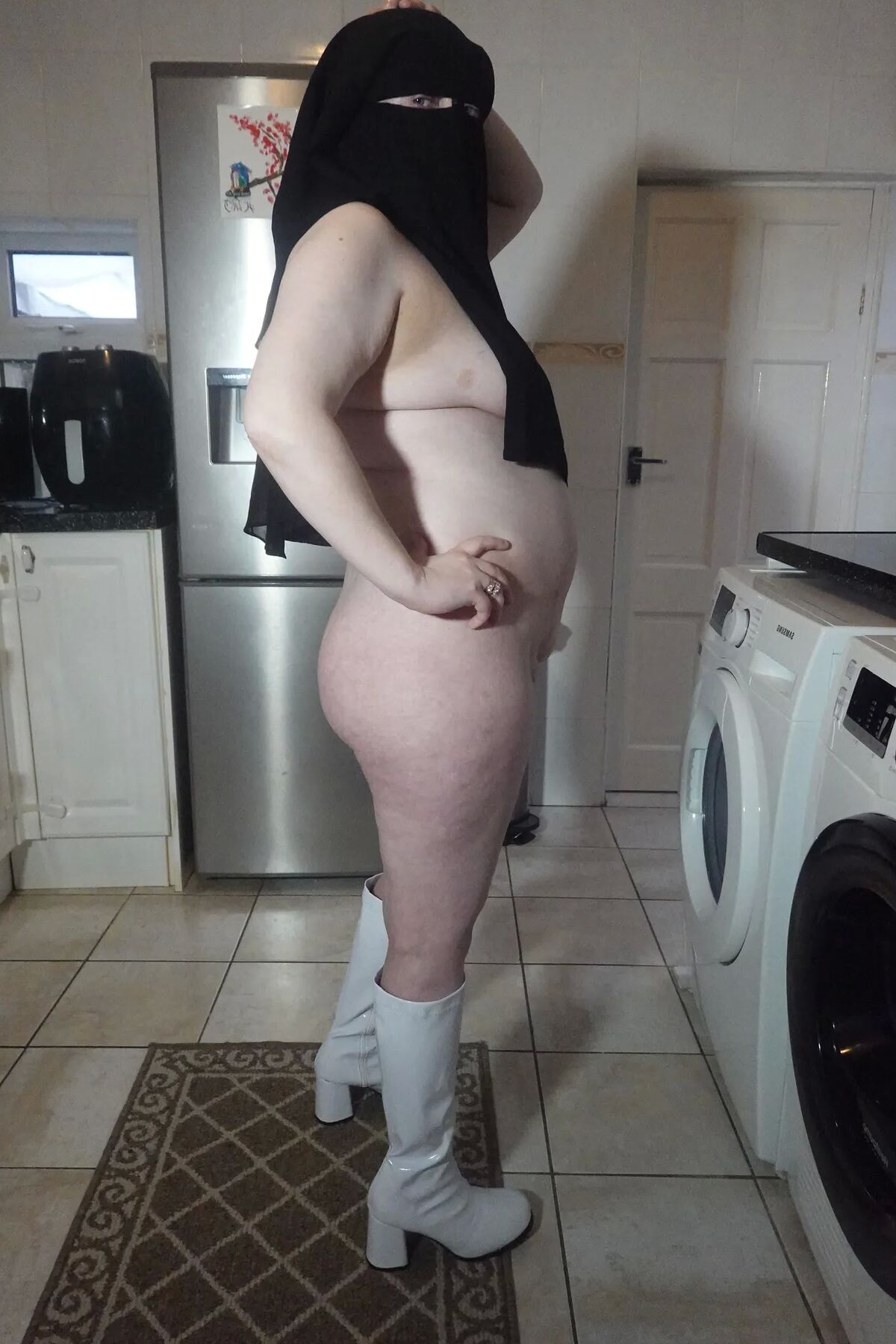 Naked in Niqab and white Knee Boots