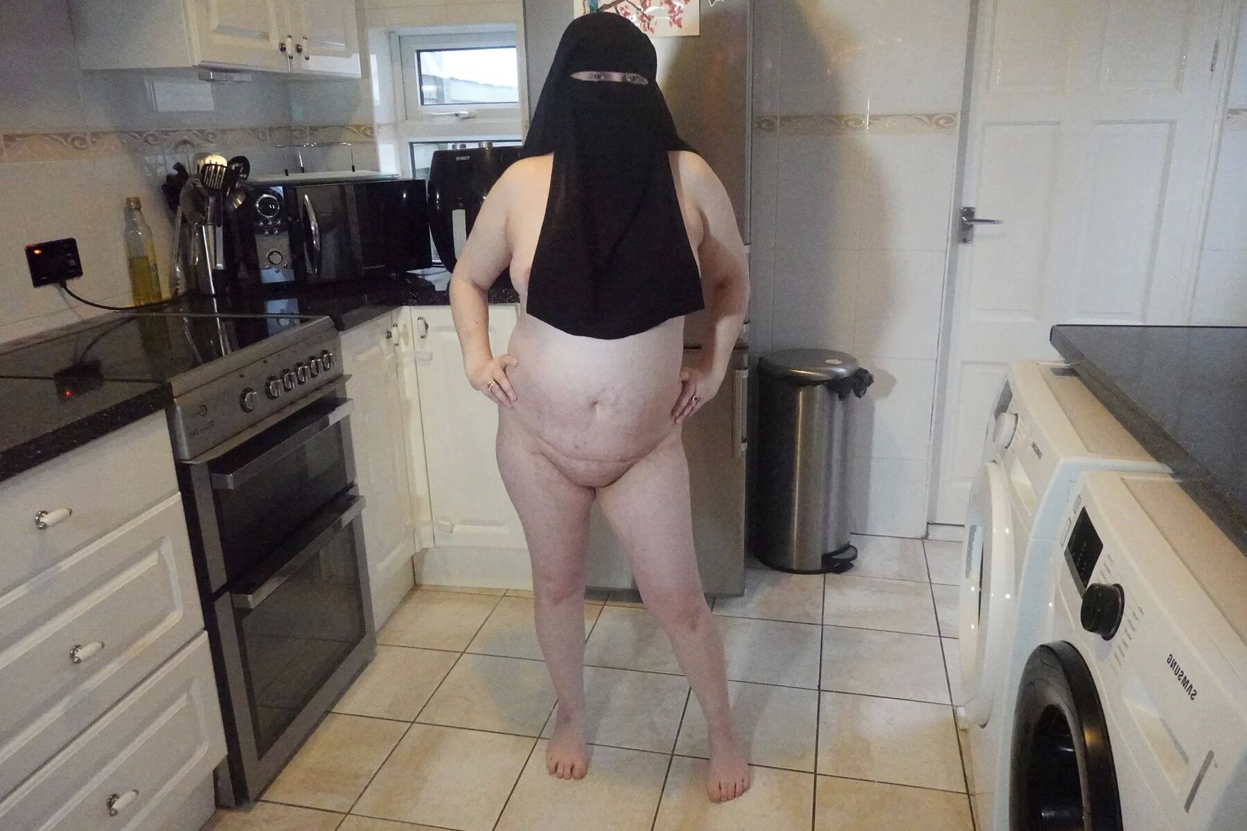 Naked in Niqab and white Knee Boots