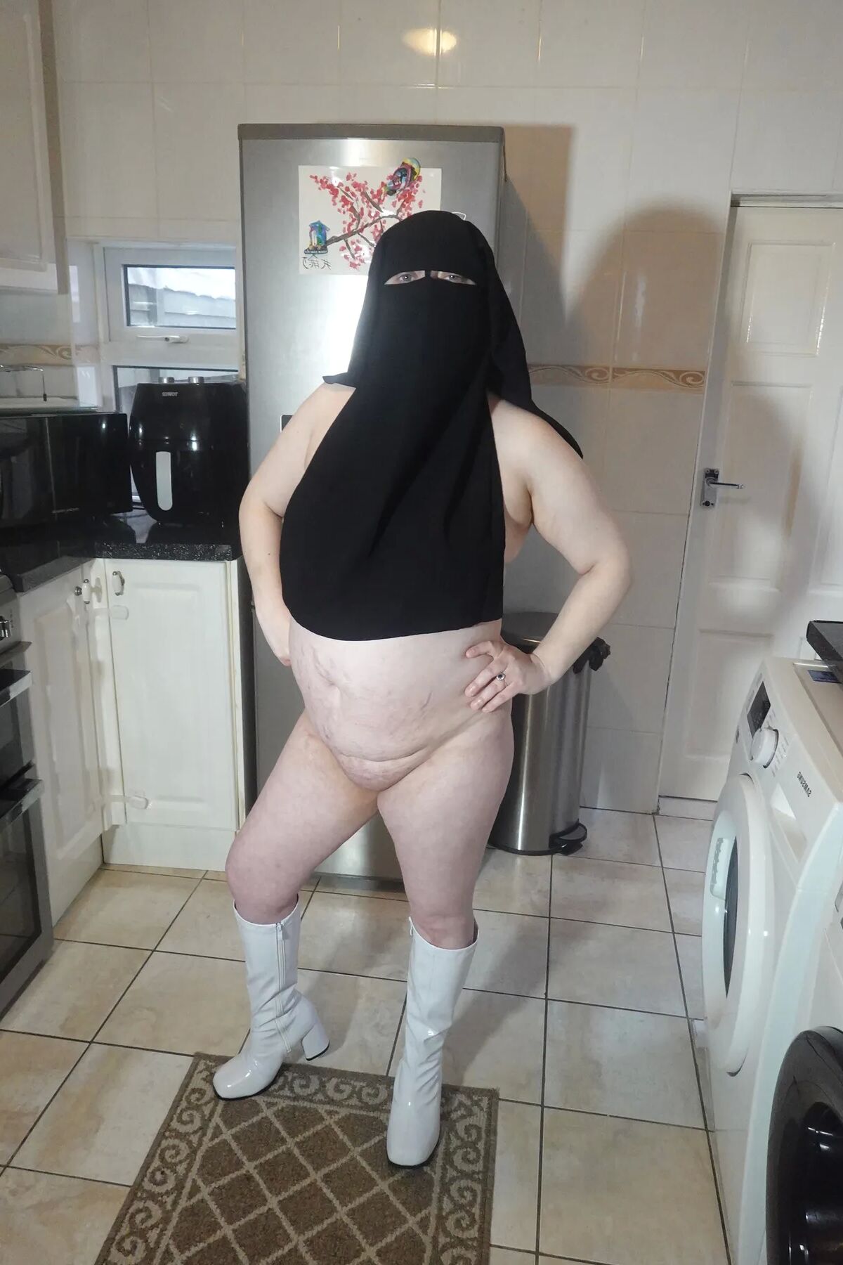 Naked in Niqab and white Knee Boots