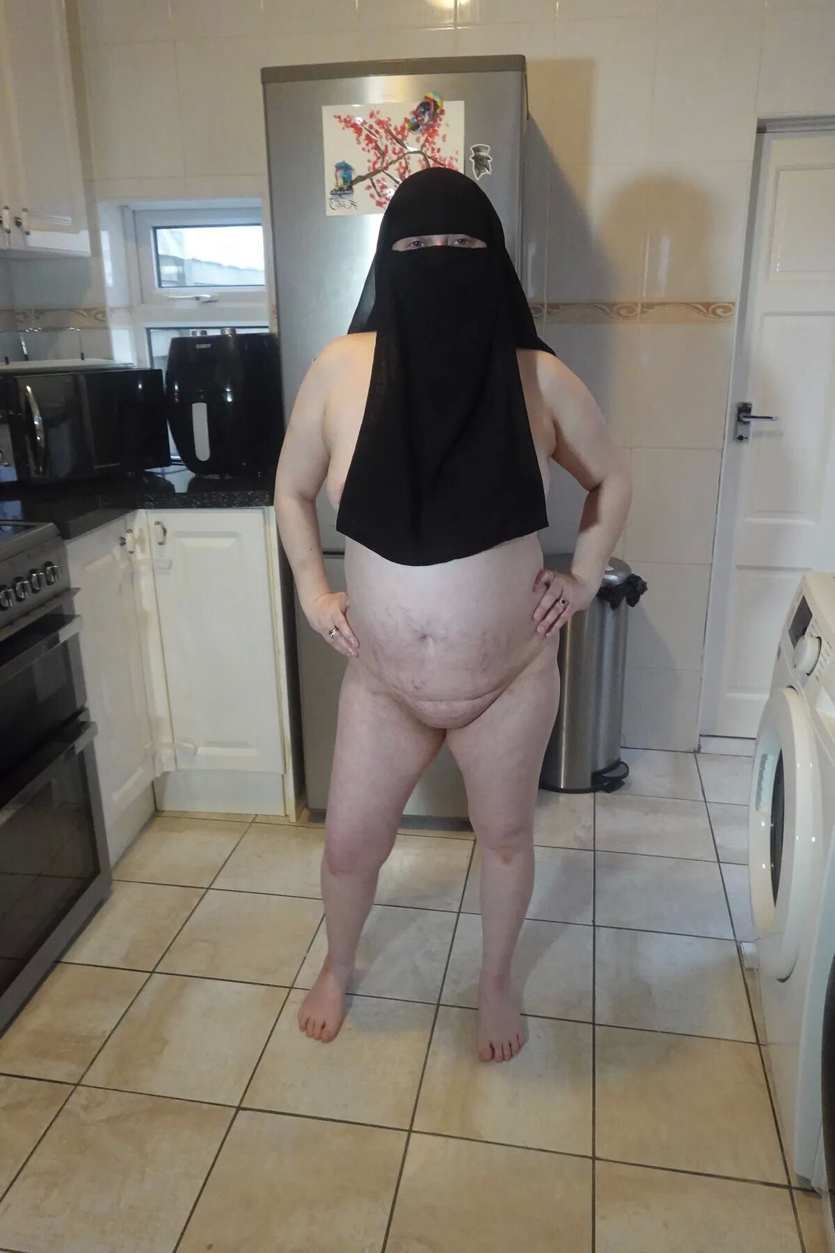 Naked in Niqab and white Knee Boots