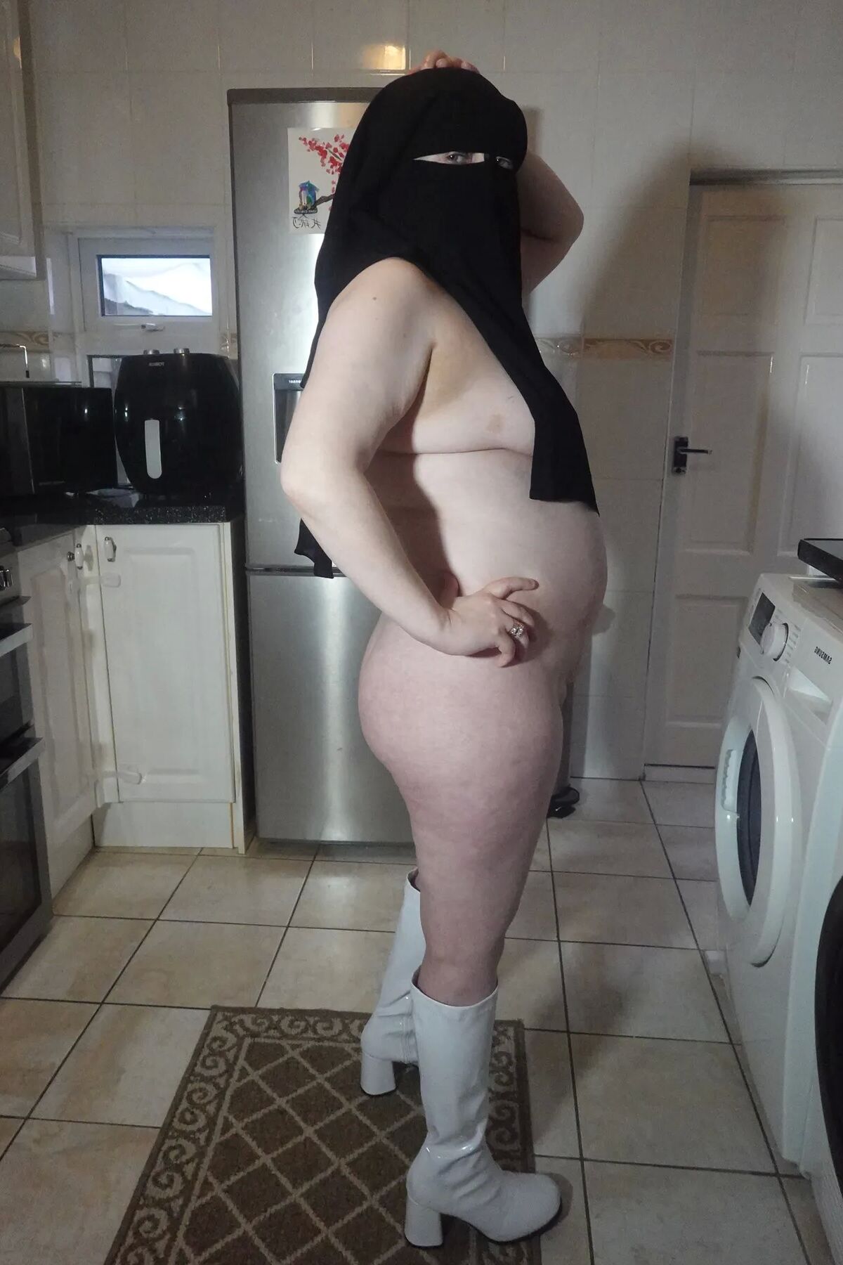 Naked in Niqab and white Knee Boots