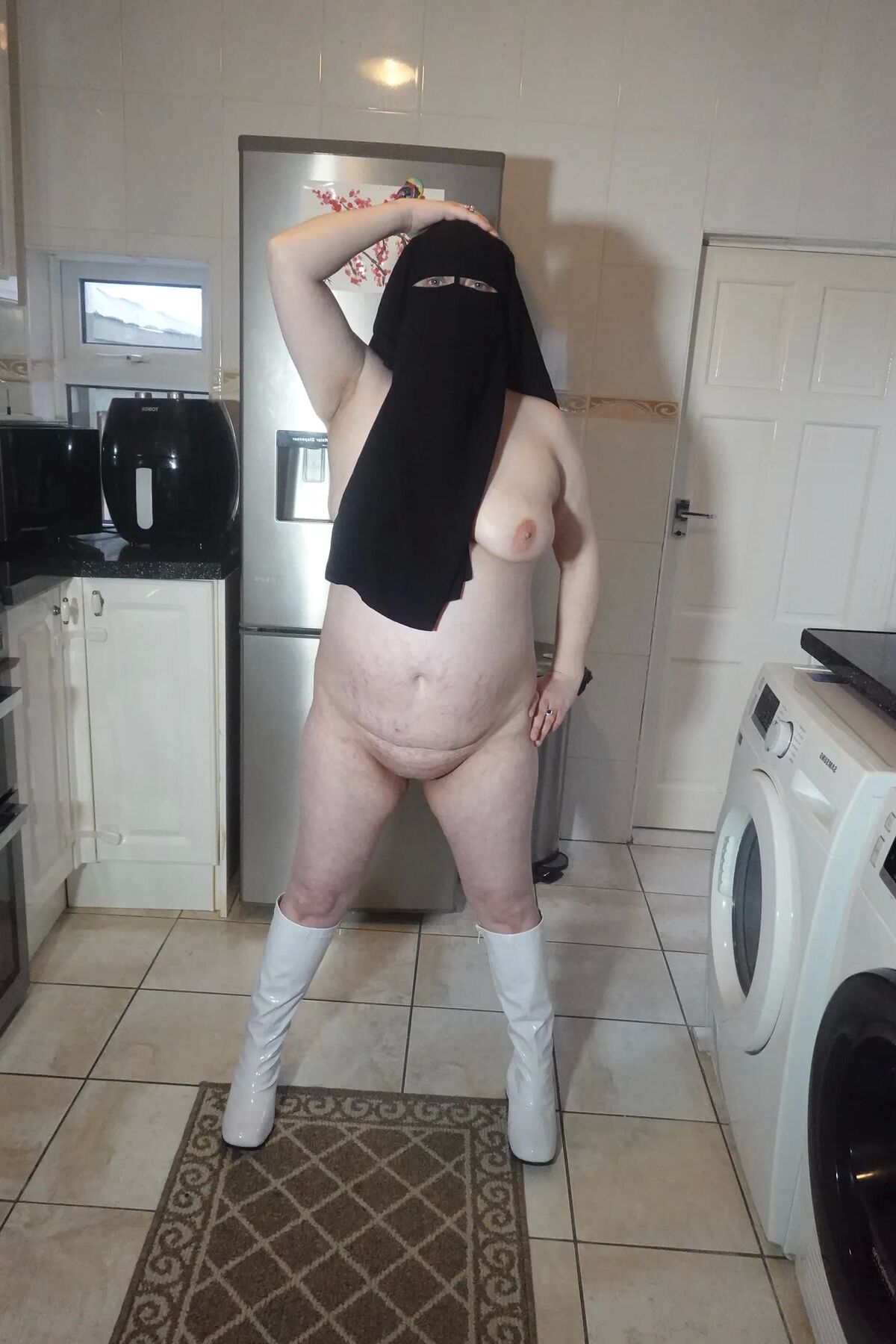 Naked in Niqab and white Knee Boots