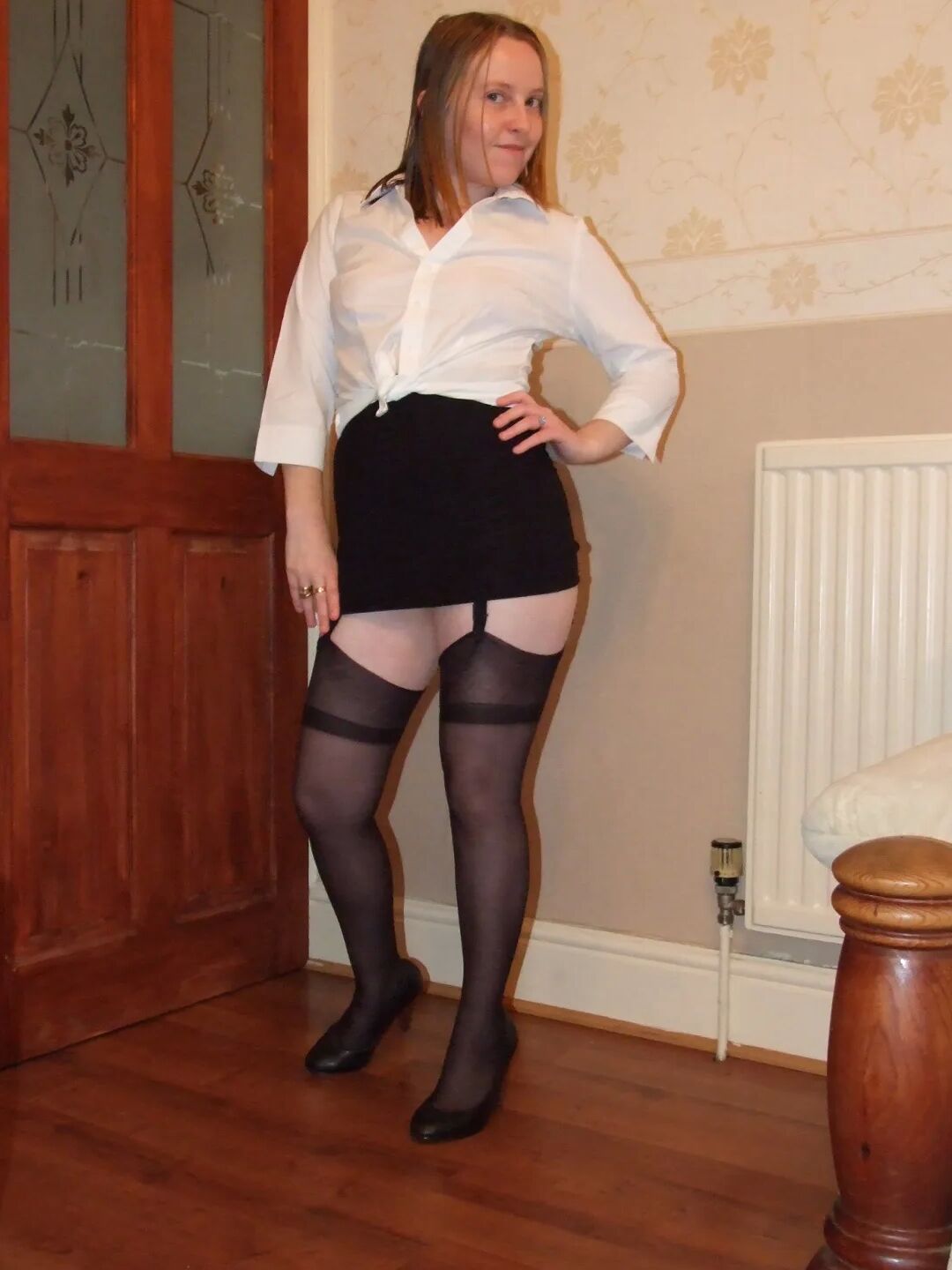 Secretary in heels miniskirt stockings and suspenders