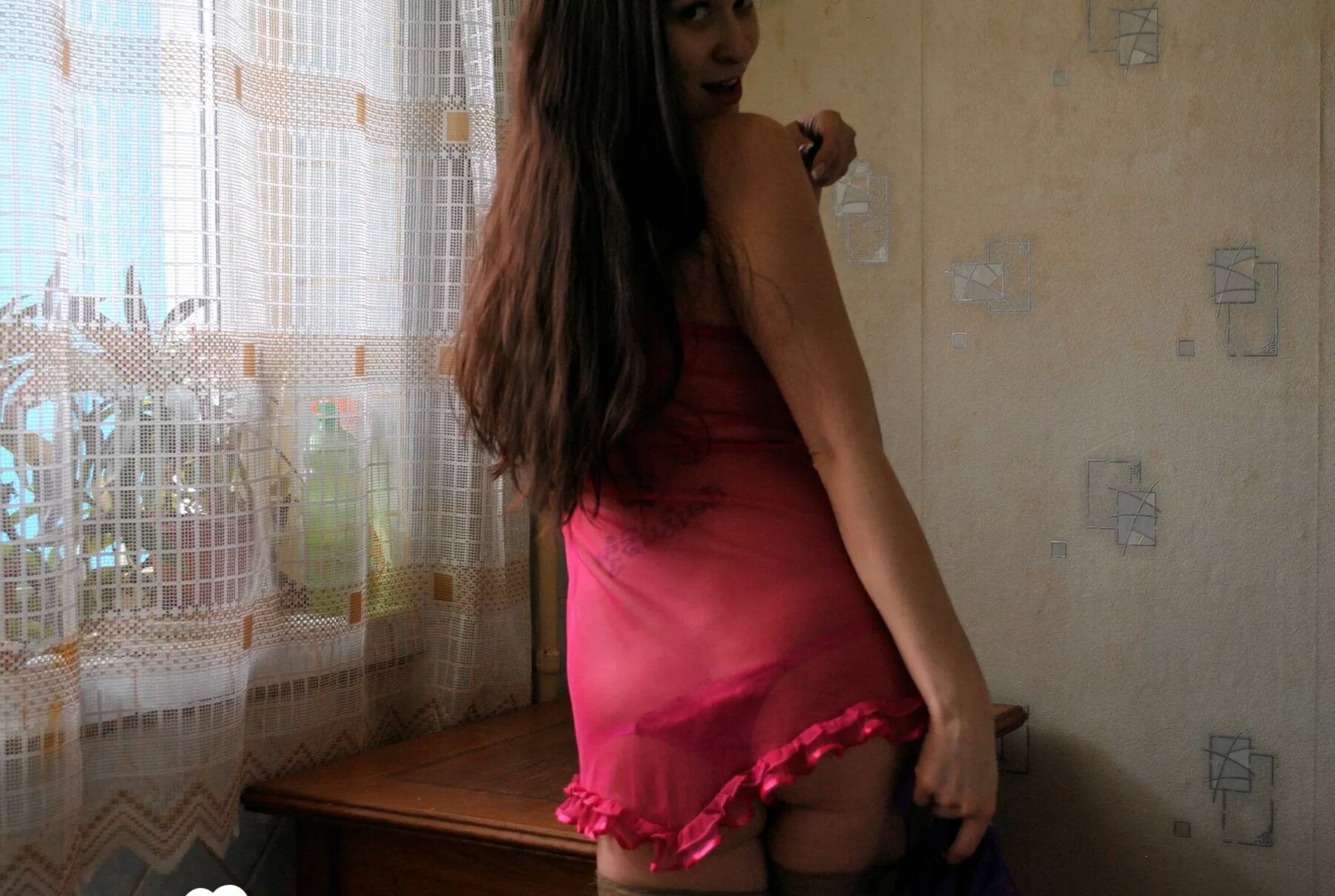 Brunette in stockings shoving a banana into herself