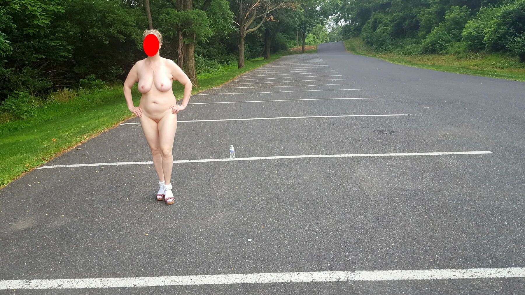 Naked parking lot walk