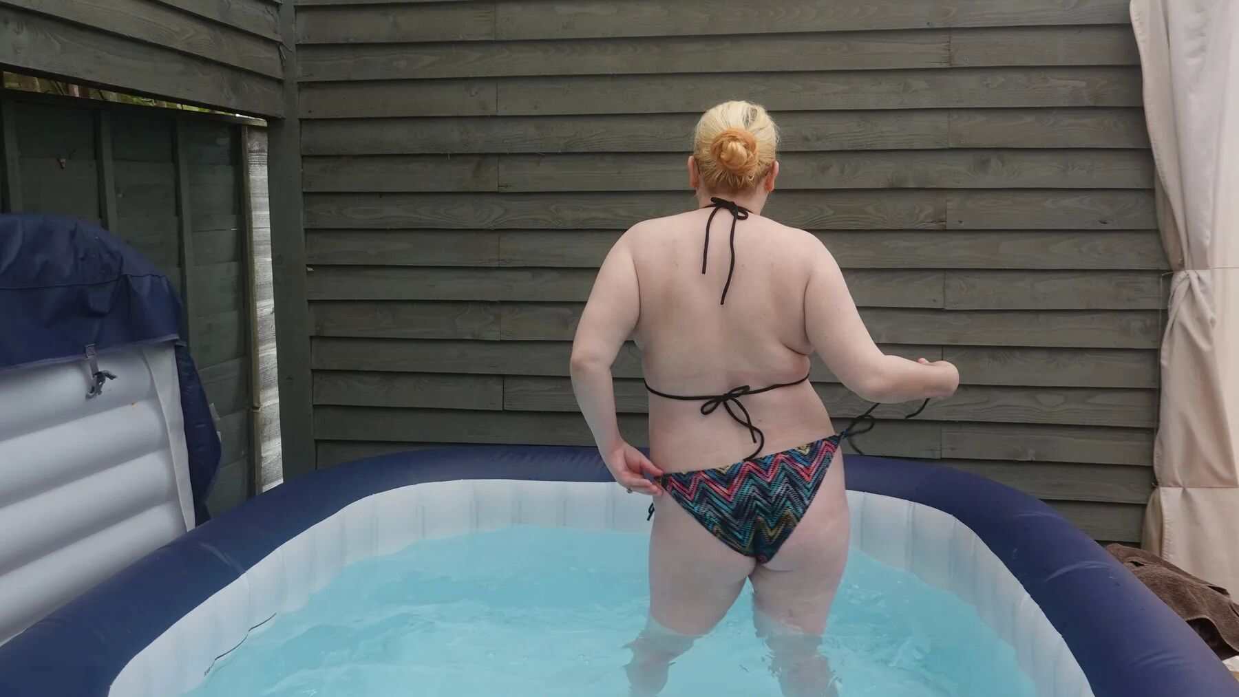 Sexy string bikini in the hot tub