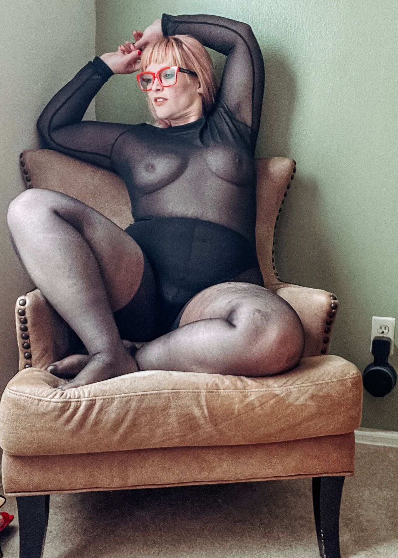 Gorgeous BBW in a black body suit see through Lace Sheer