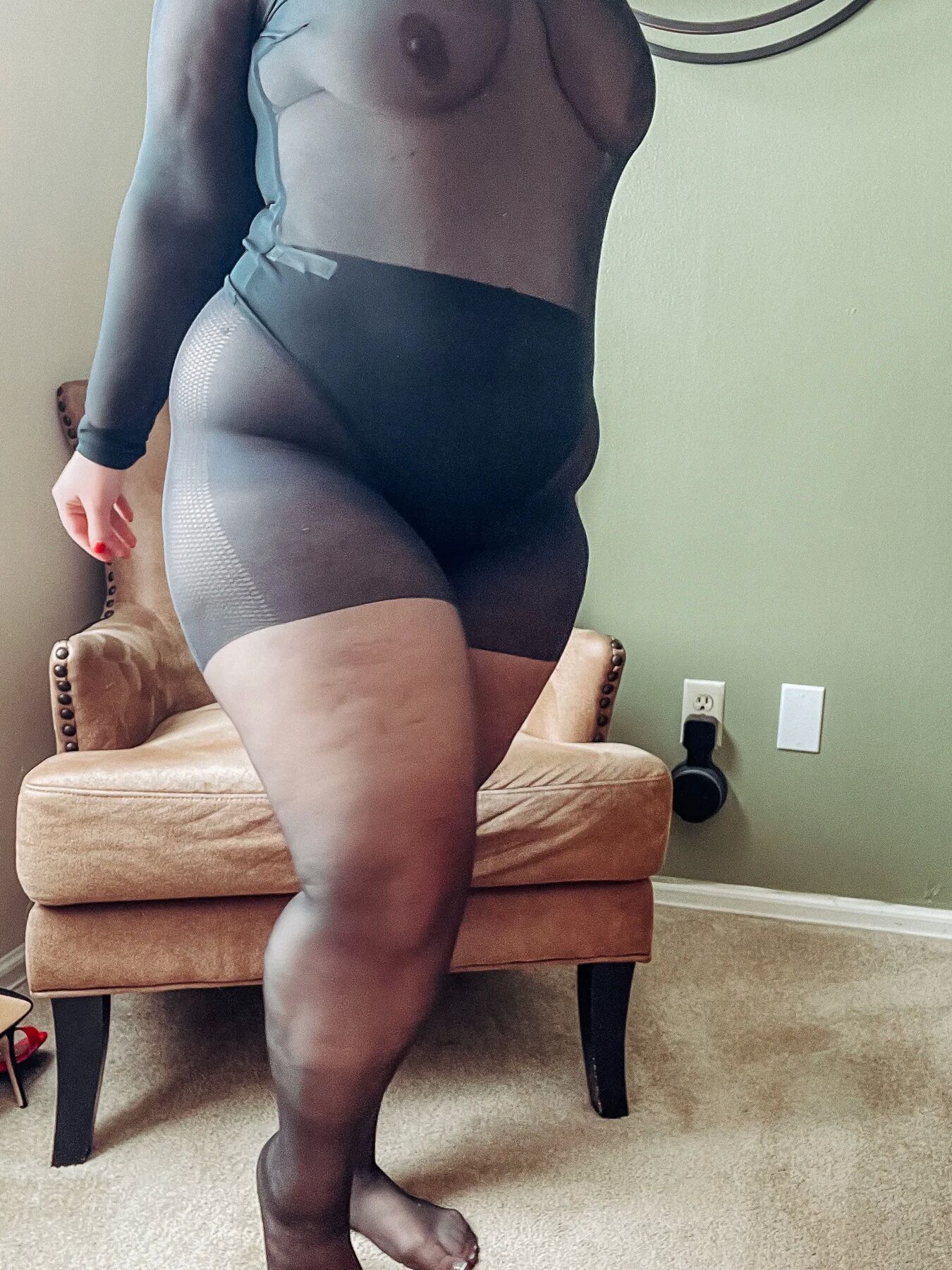 Gorgeous BBW in a black body suit see through Lace Sheer