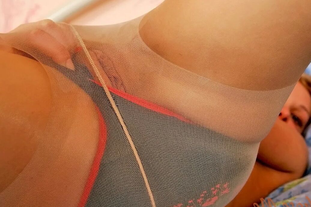 Sexy blonde in panties and pantyhose