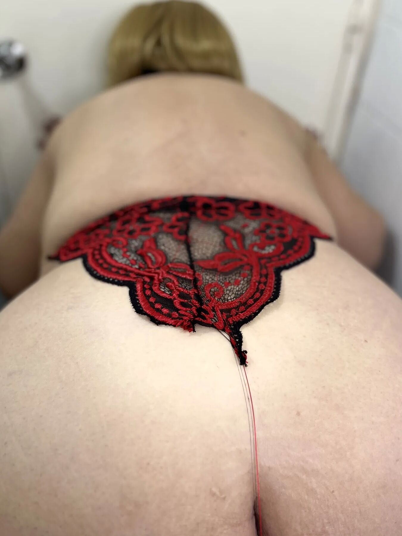 Sexy and very fat granny wearing red lingerie