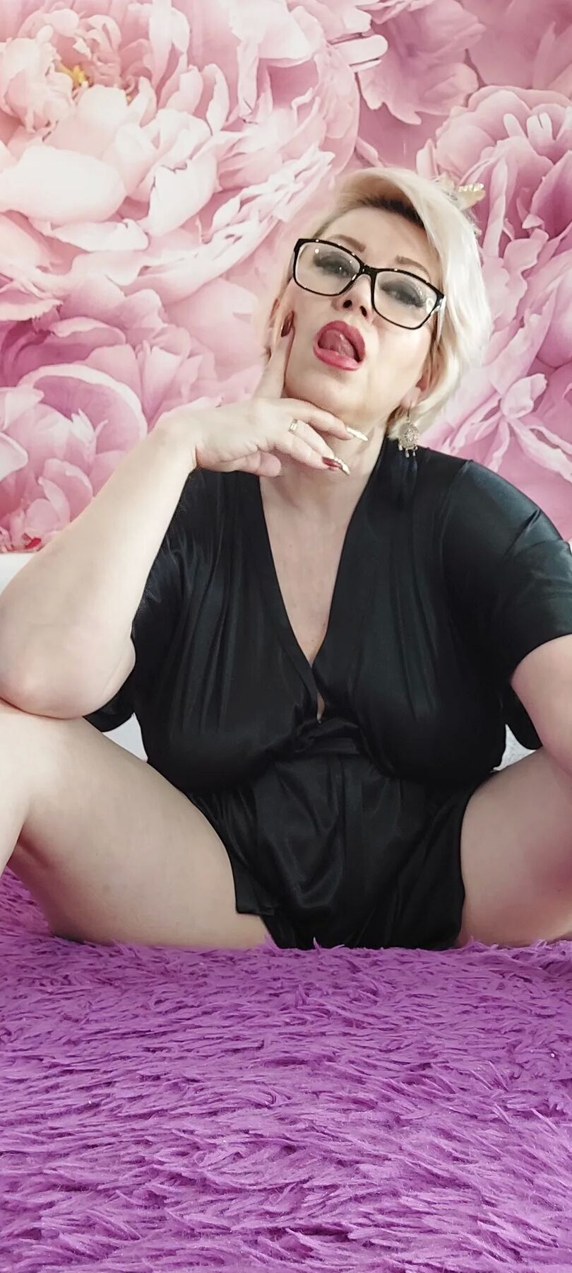 A cool mature bitch in a black negligee...