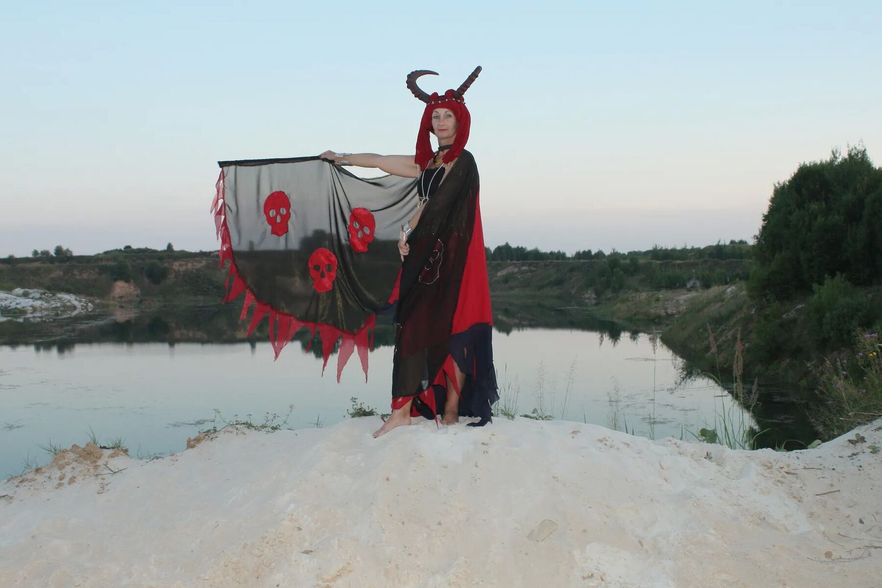 Witch over lake on sunset