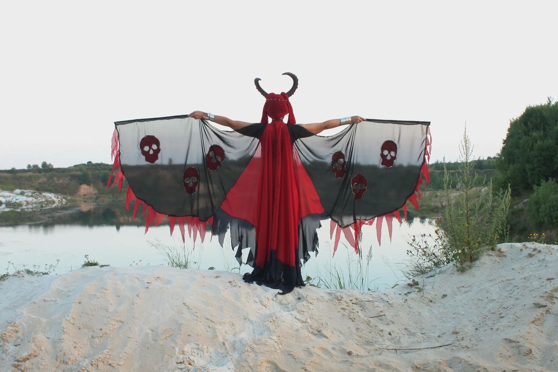 Witch over lake on sunset