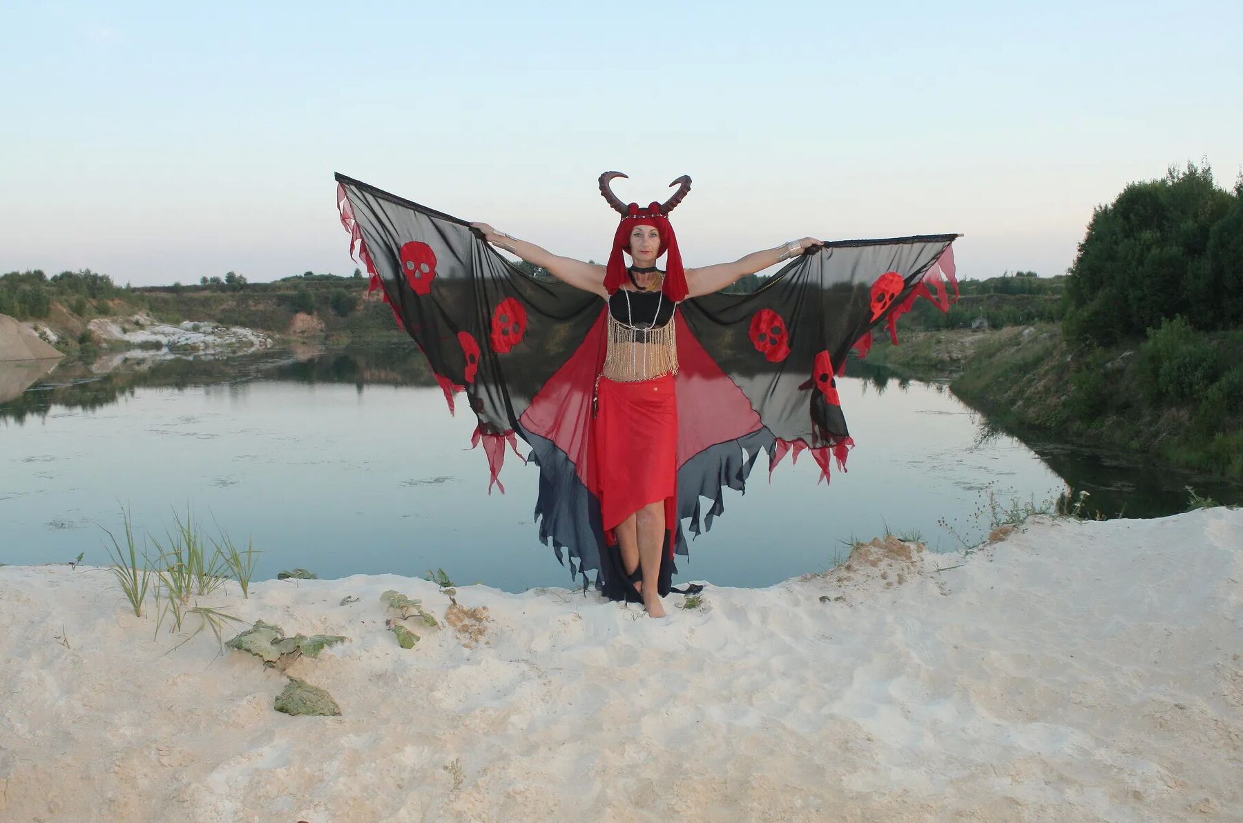Witch over lake on sunset
