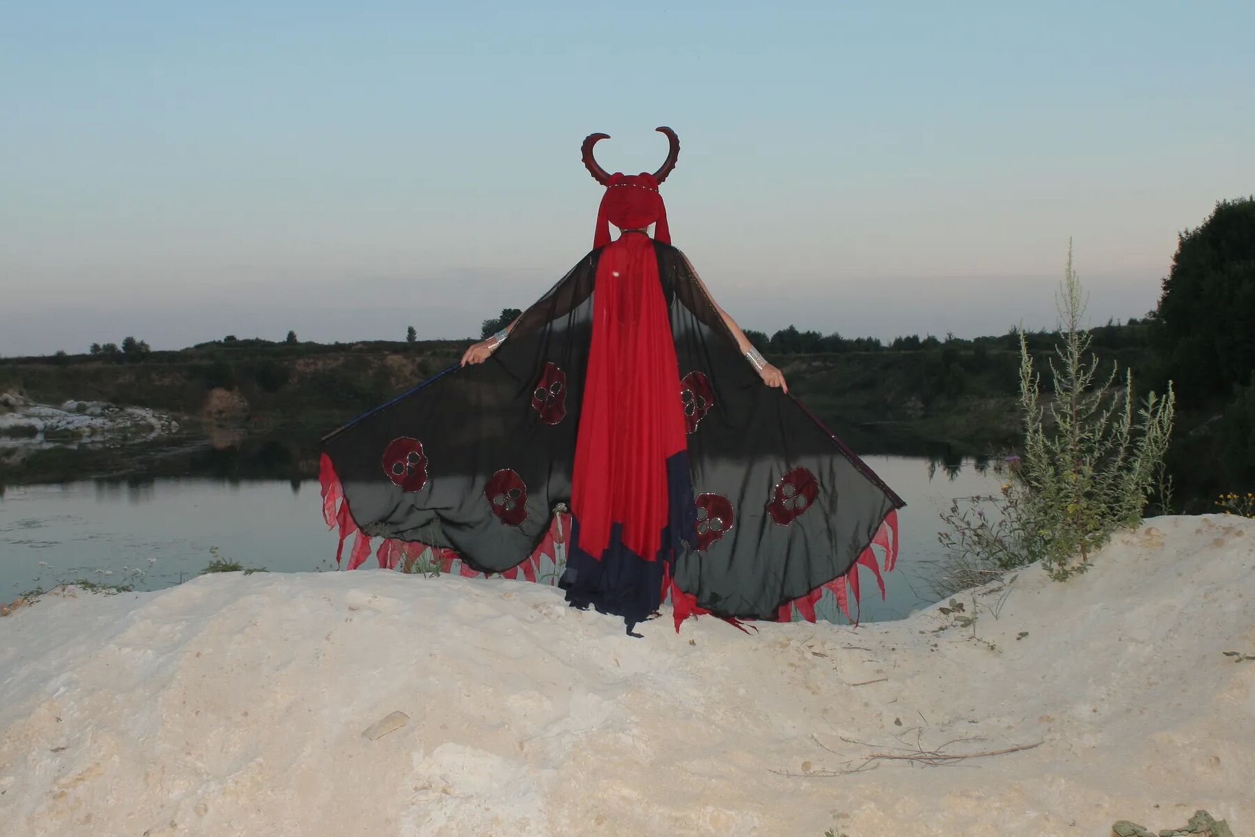Witch over lake on sunset