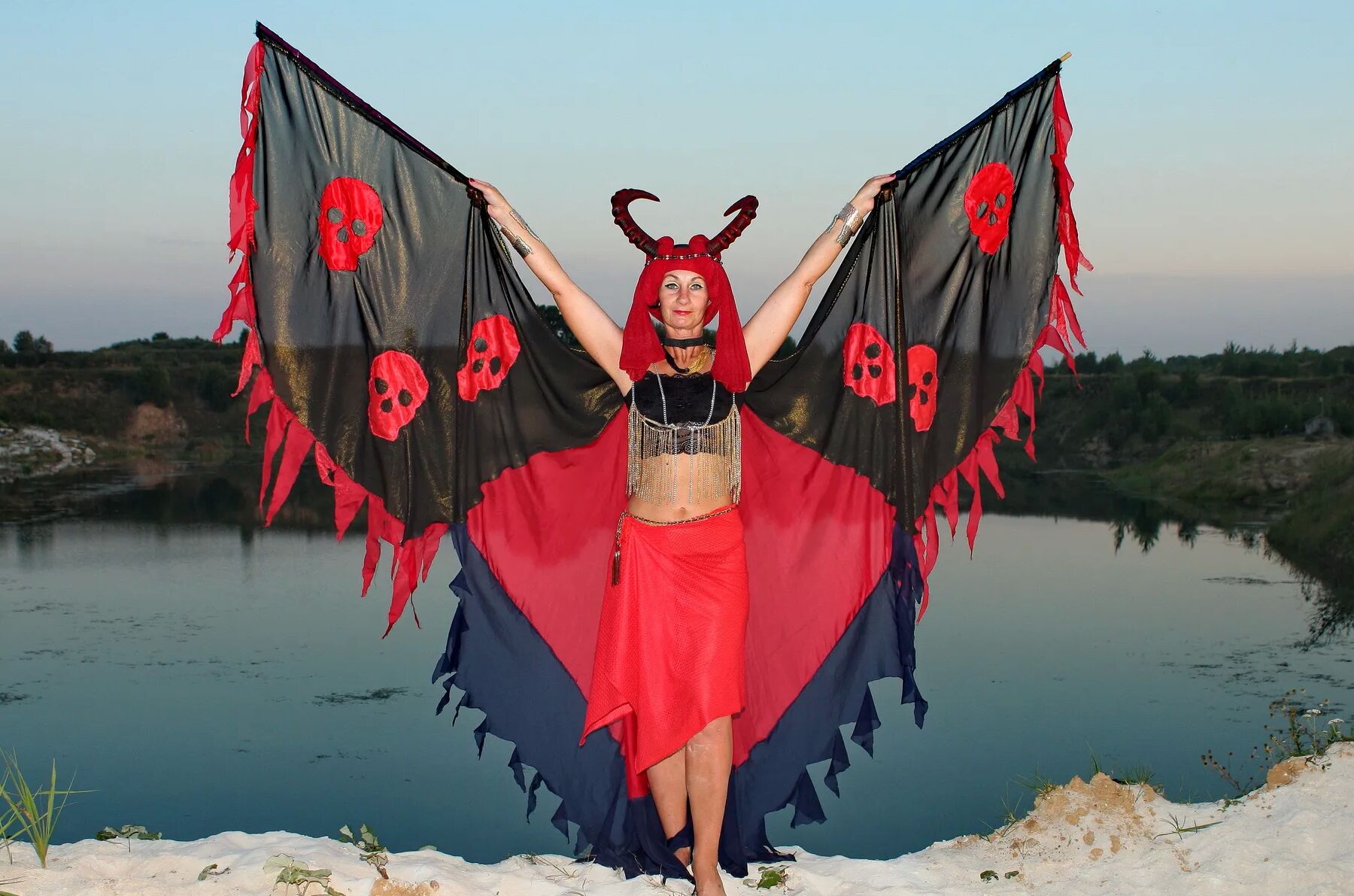 Witch over lake on sunset