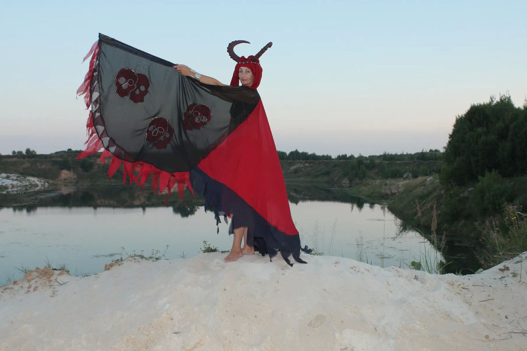 Witch over lake on sunset