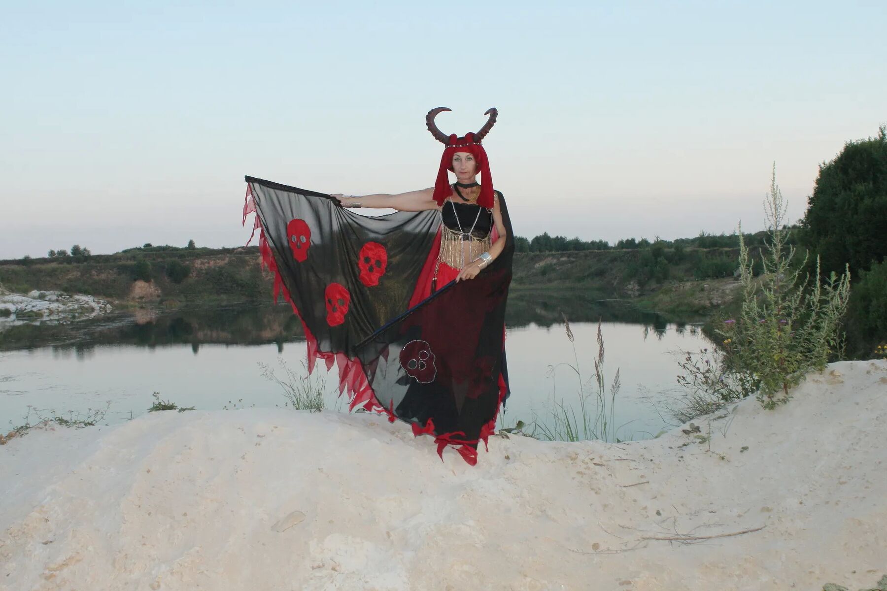 Witch over lake on sunset