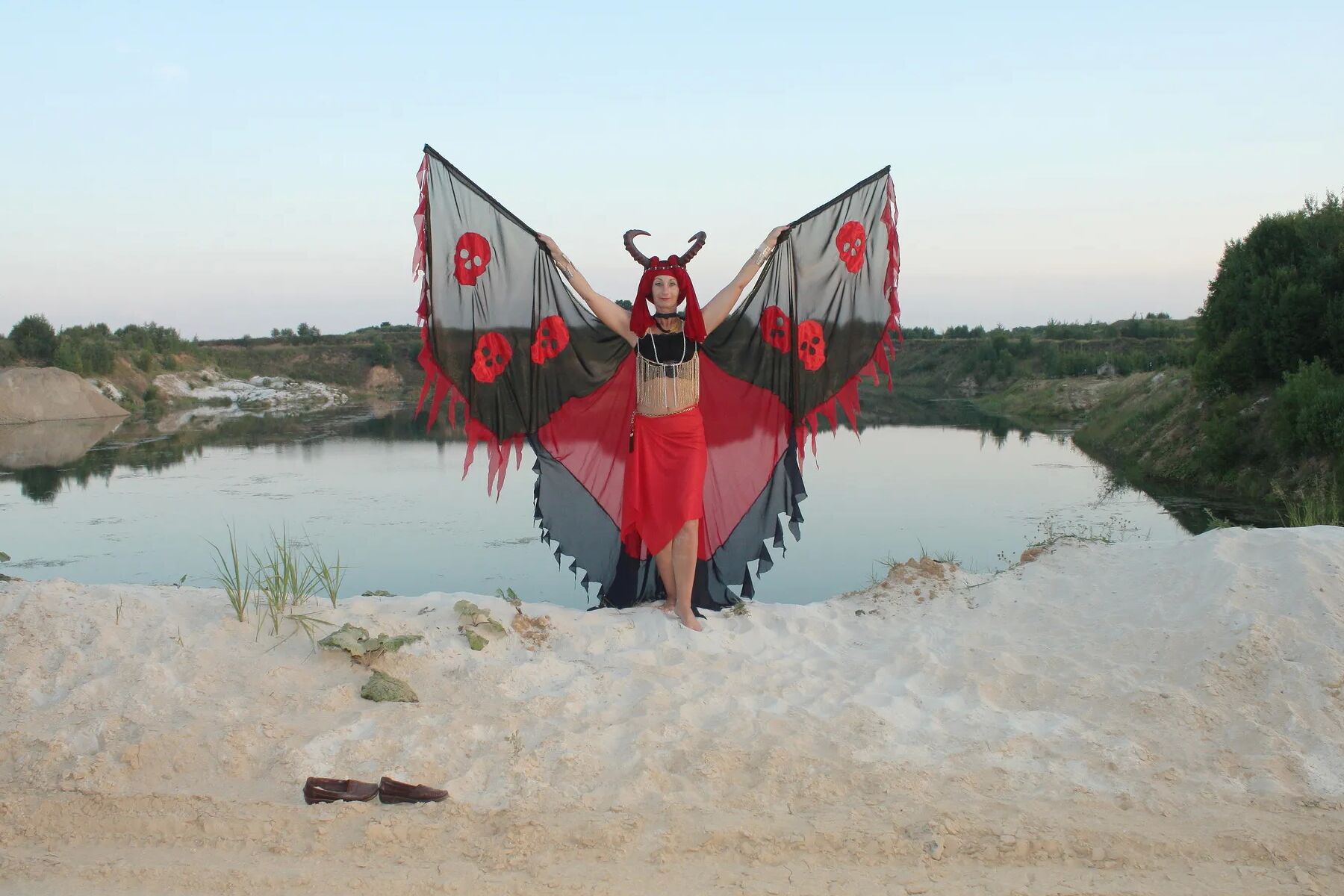 Witch over lake on sunset