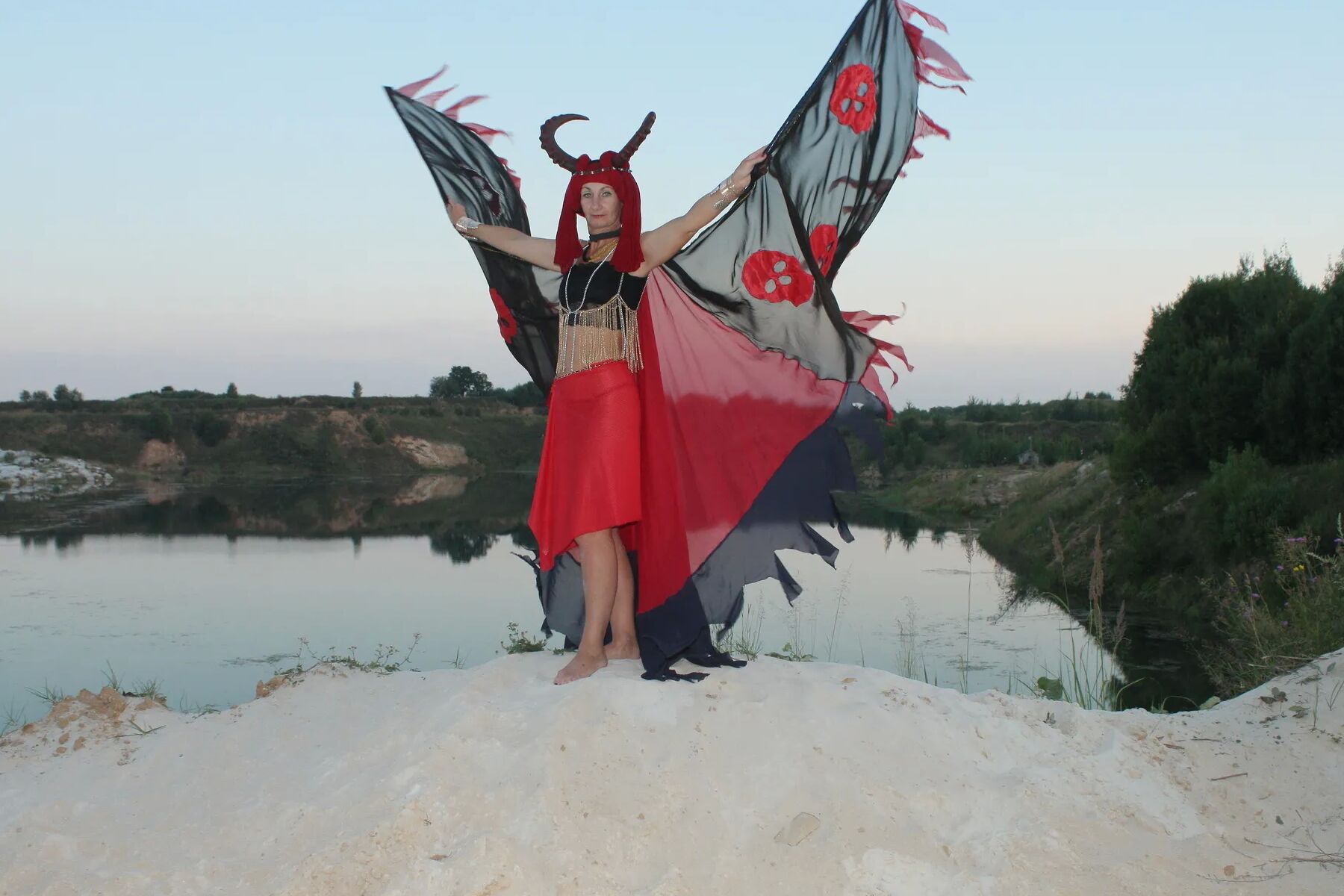 Witch over lake on sunset