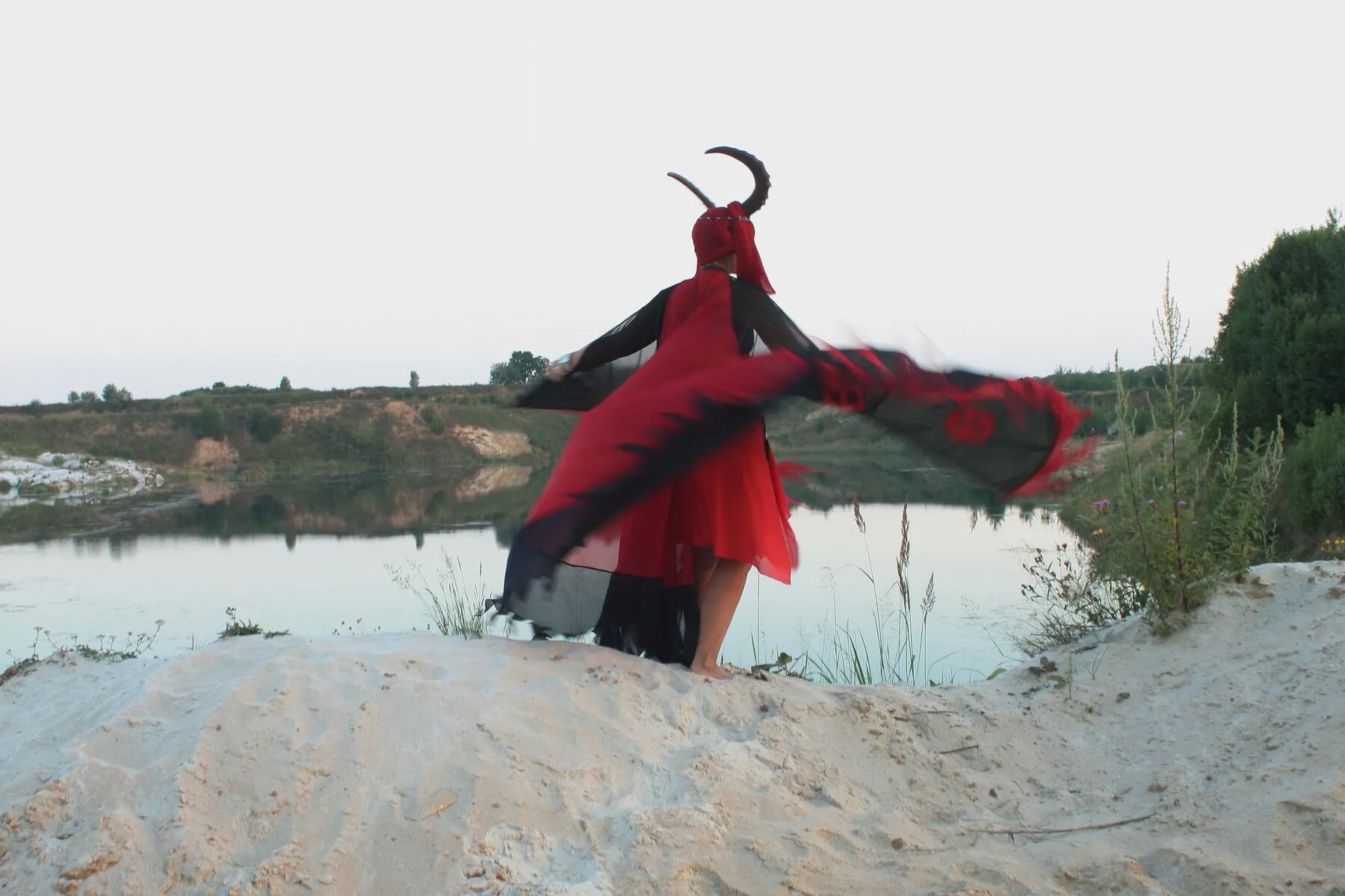Witch over lake on sunset