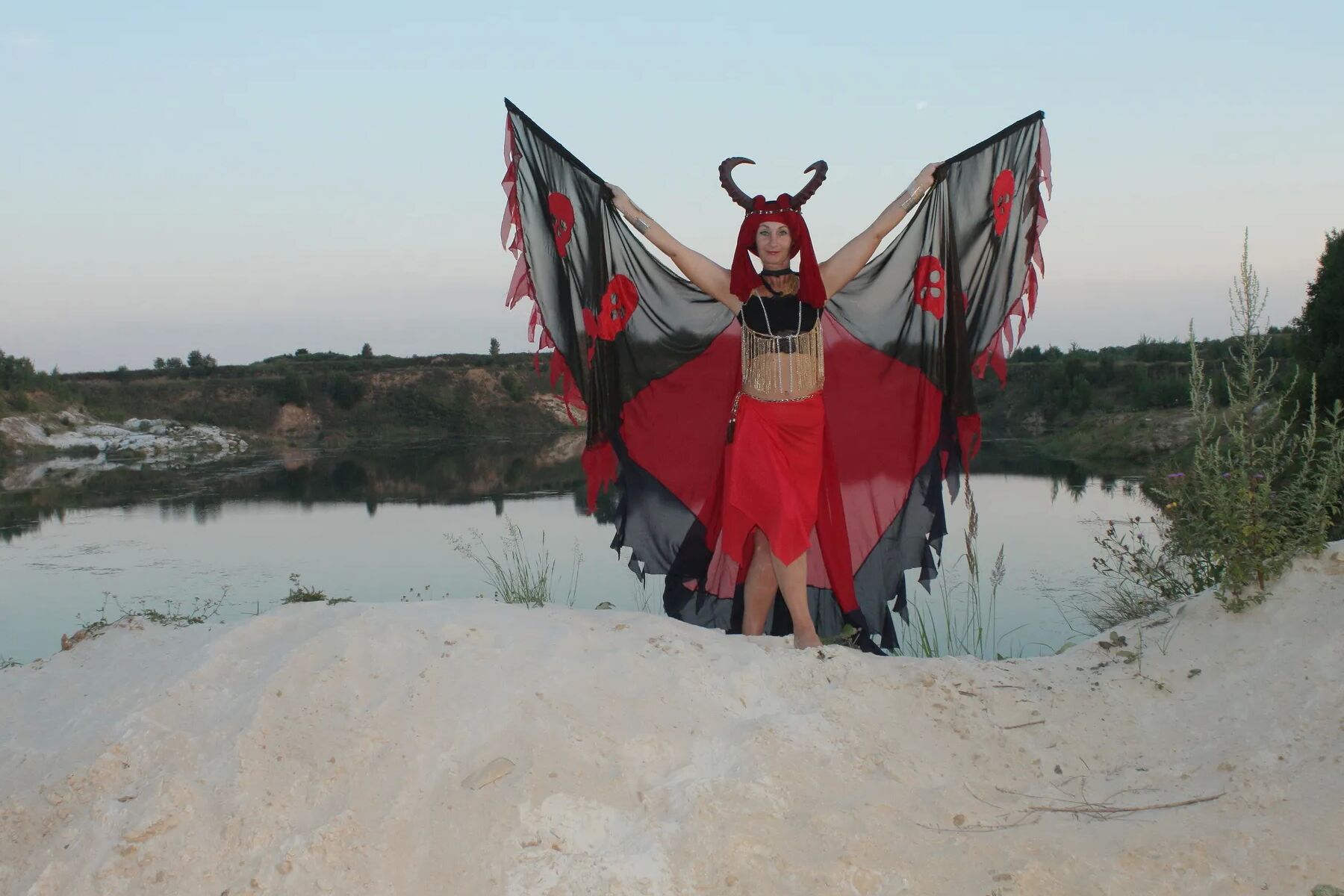Witch over lake on sunset