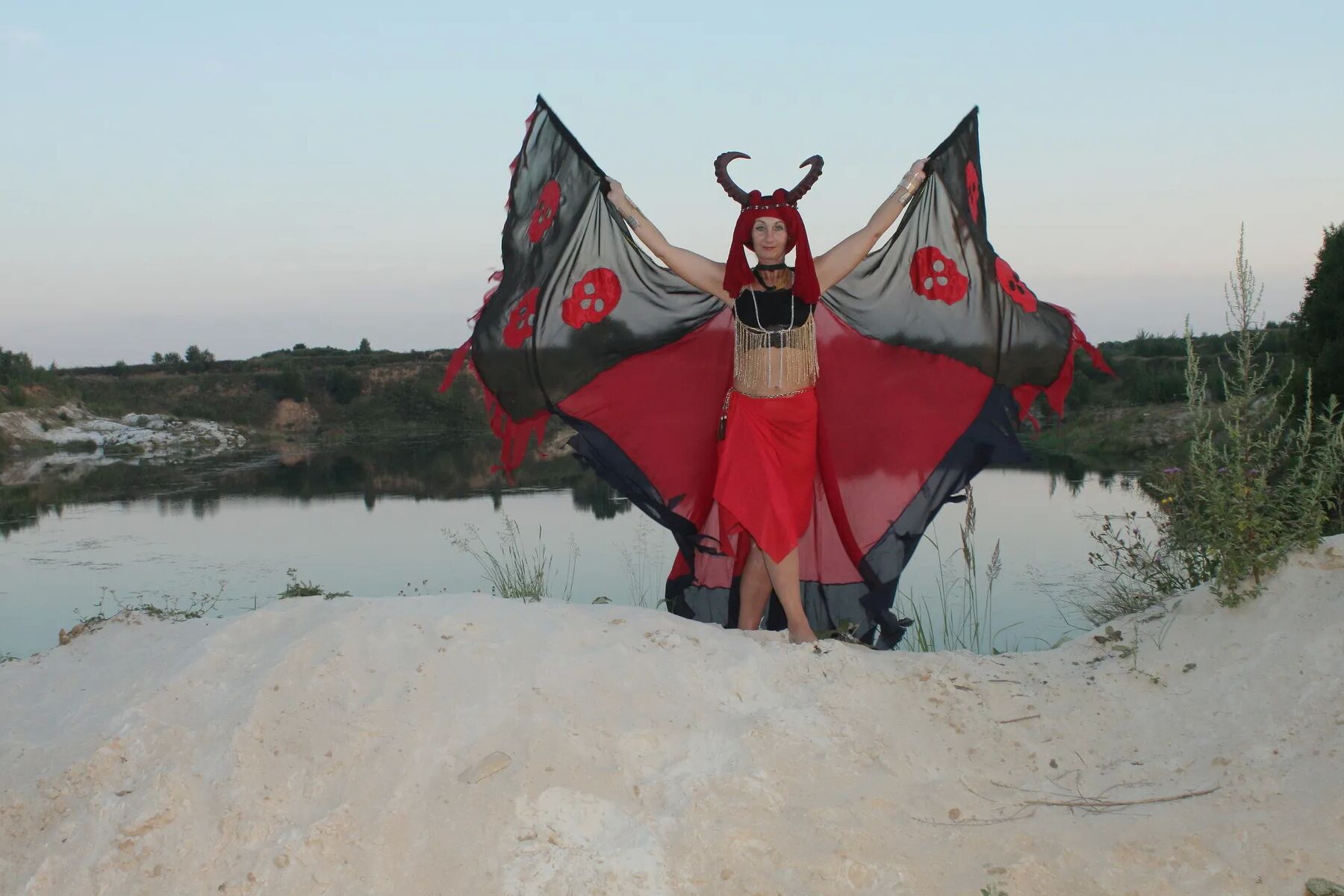 Witch over lake on sunset