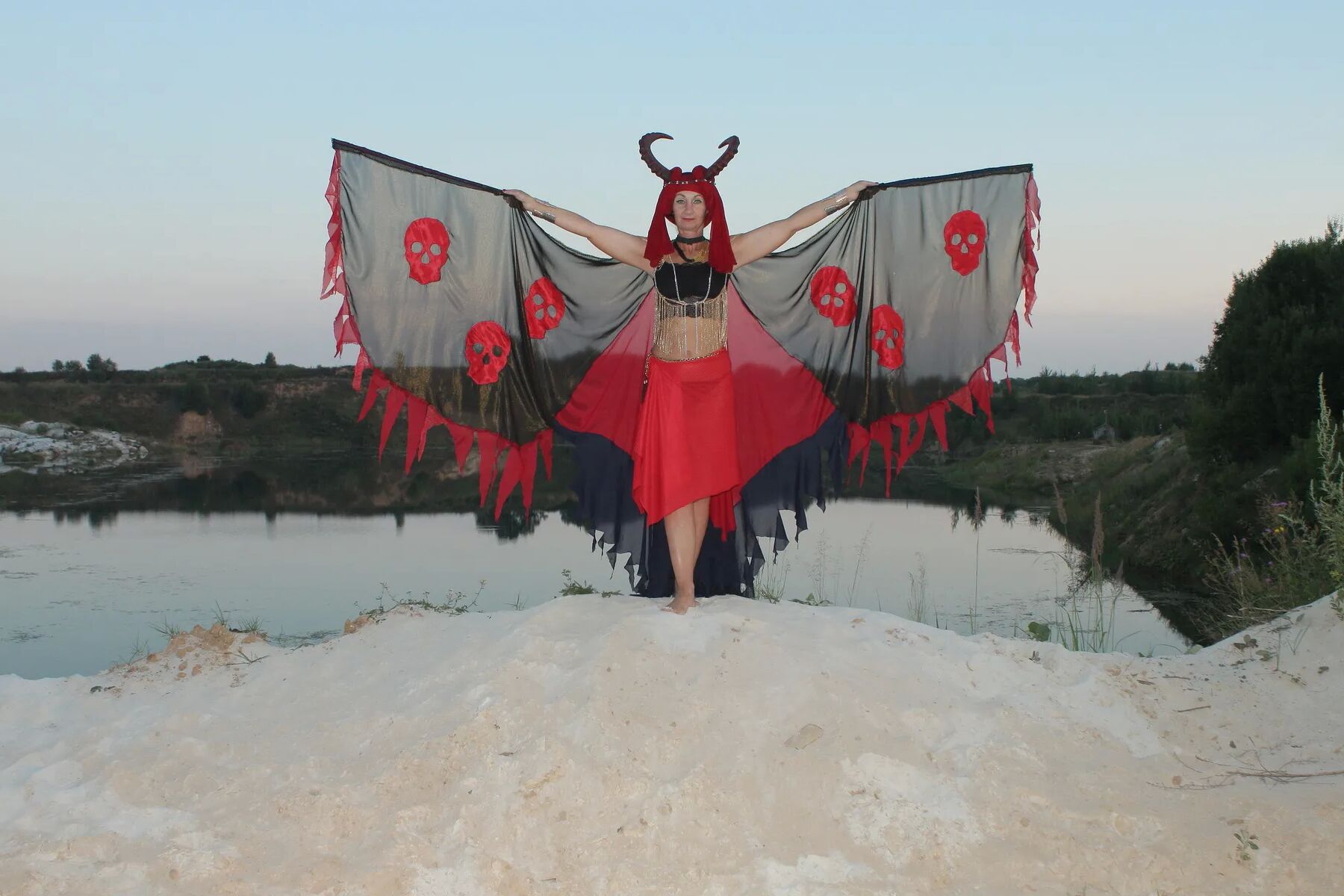 Witch over lake on sunset