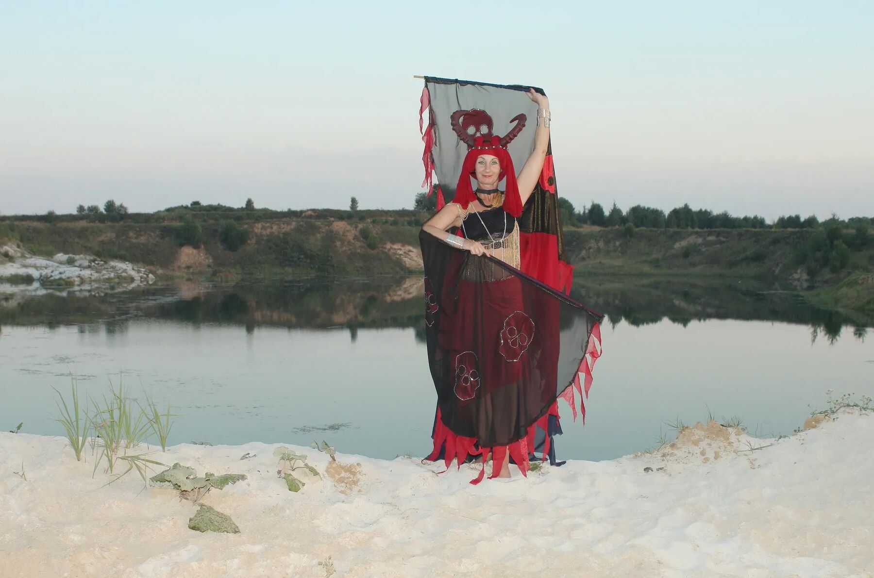 Witch over lake on sunset