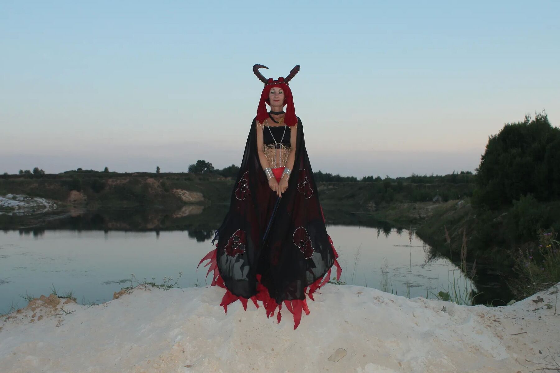 Witch over lake on sunset
