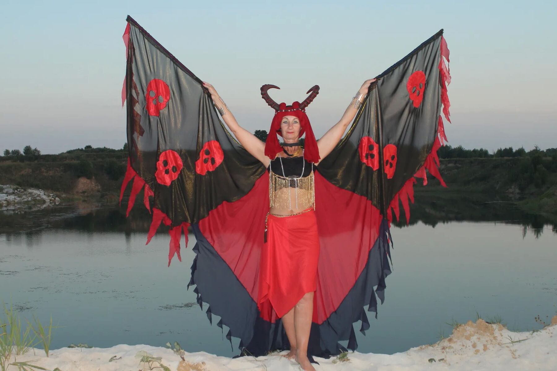 Witch over lake on sunset
