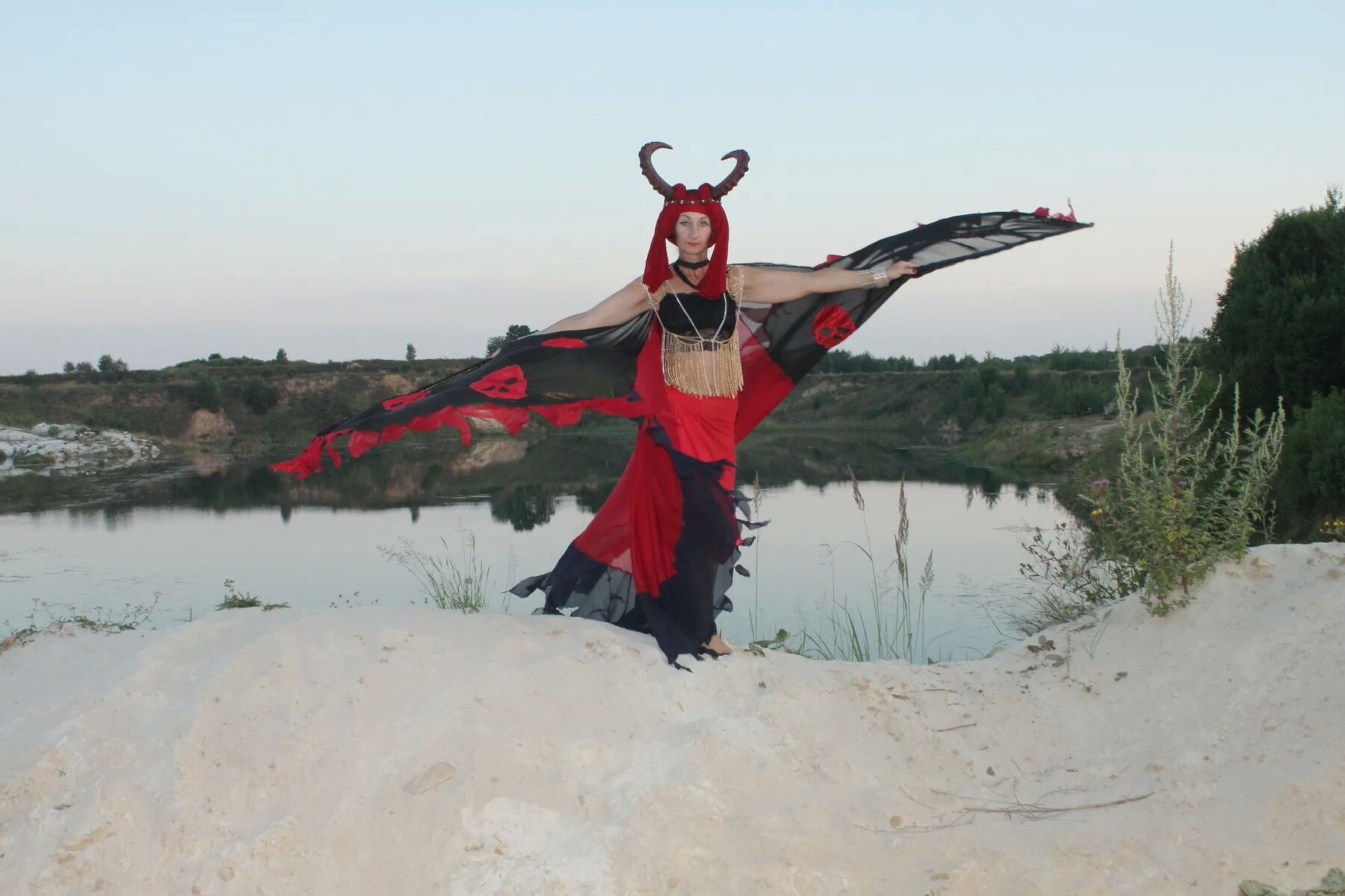 Witch over lake on sunset