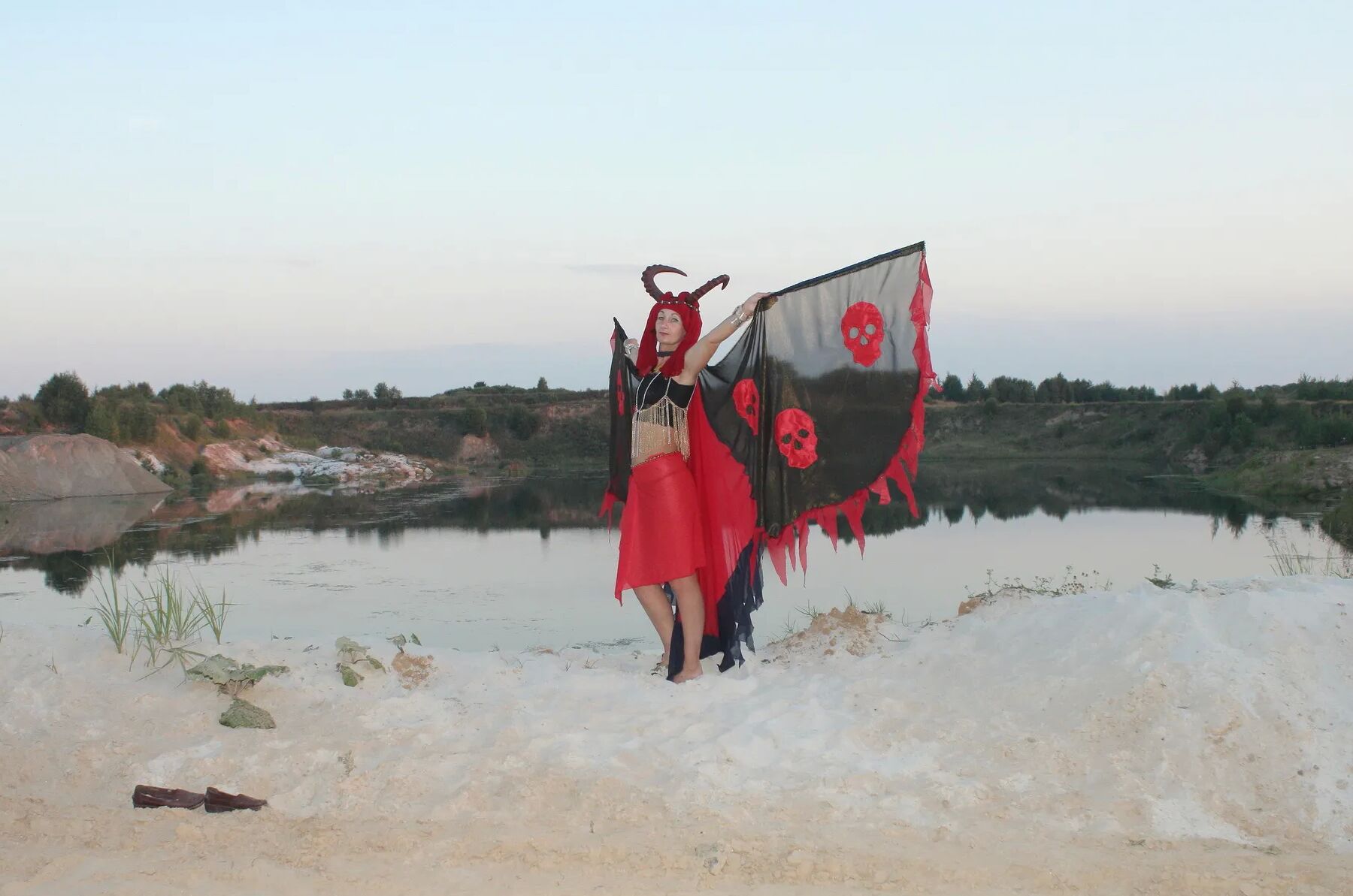 Witch over lake on sunset