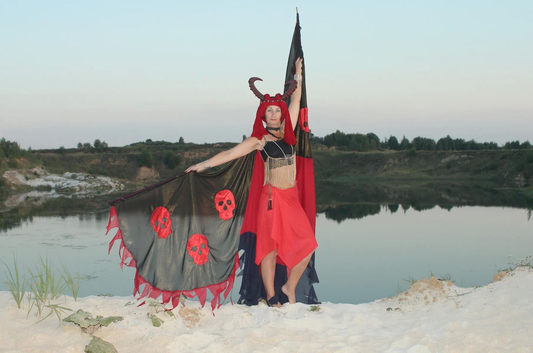 Witch over lake on sunset