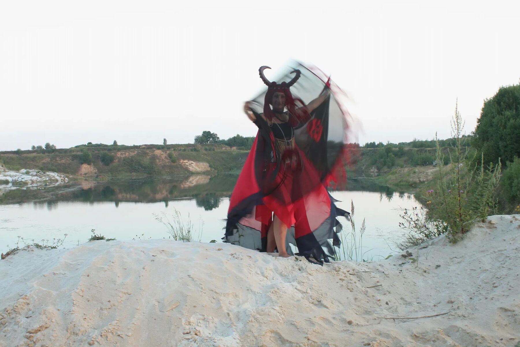 Witch over lake on sunset