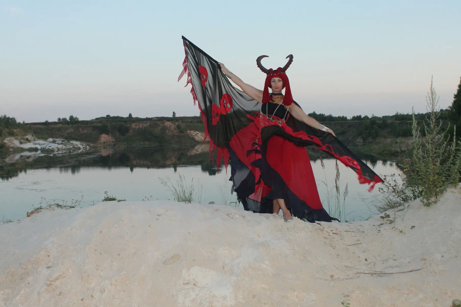 Witch over lake on sunset
