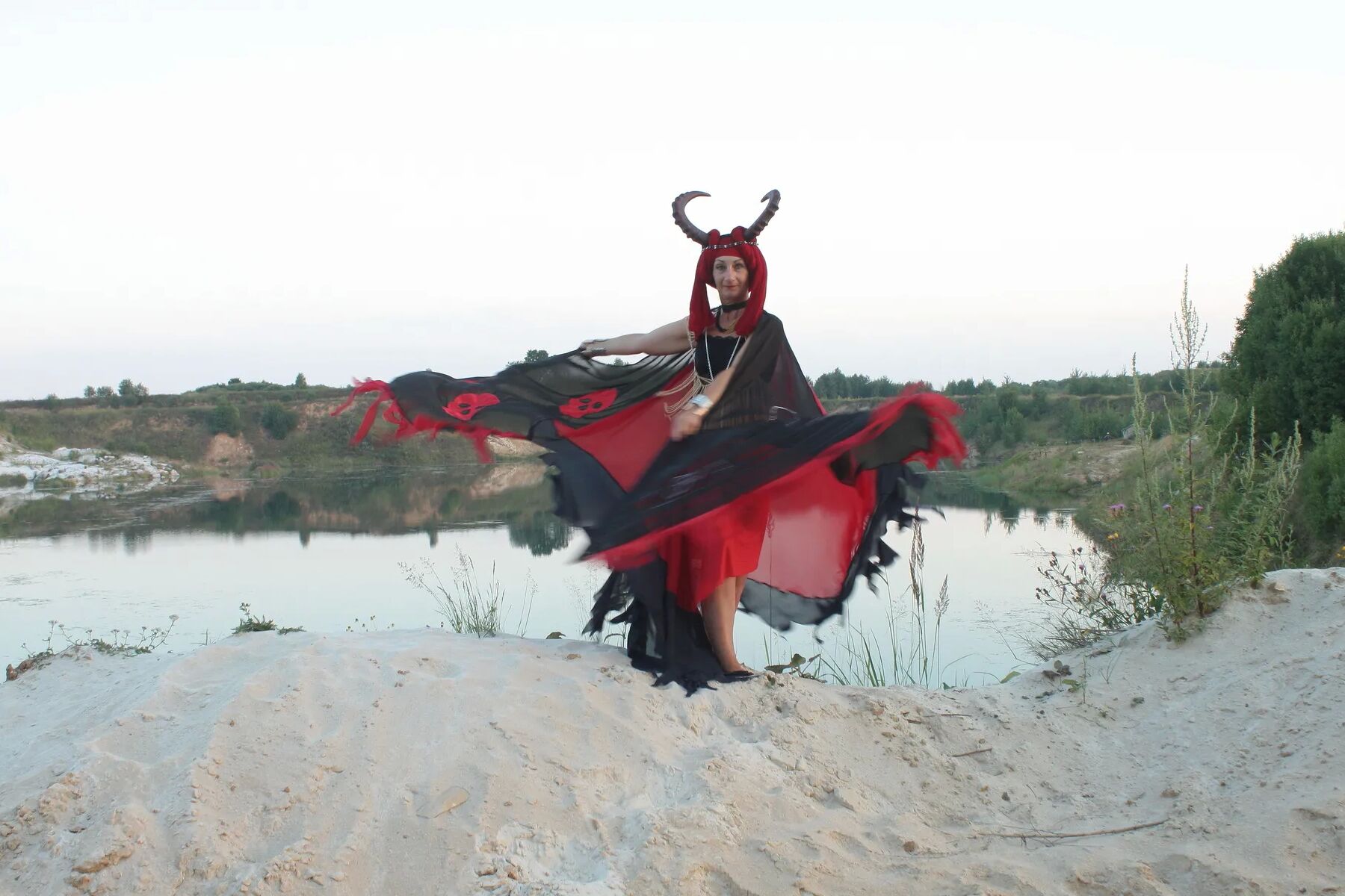 Witch over lake on sunset