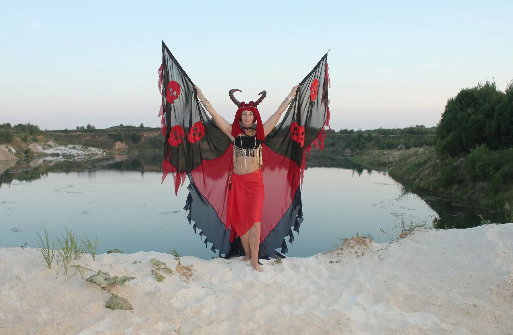 Witch over lake on sunset