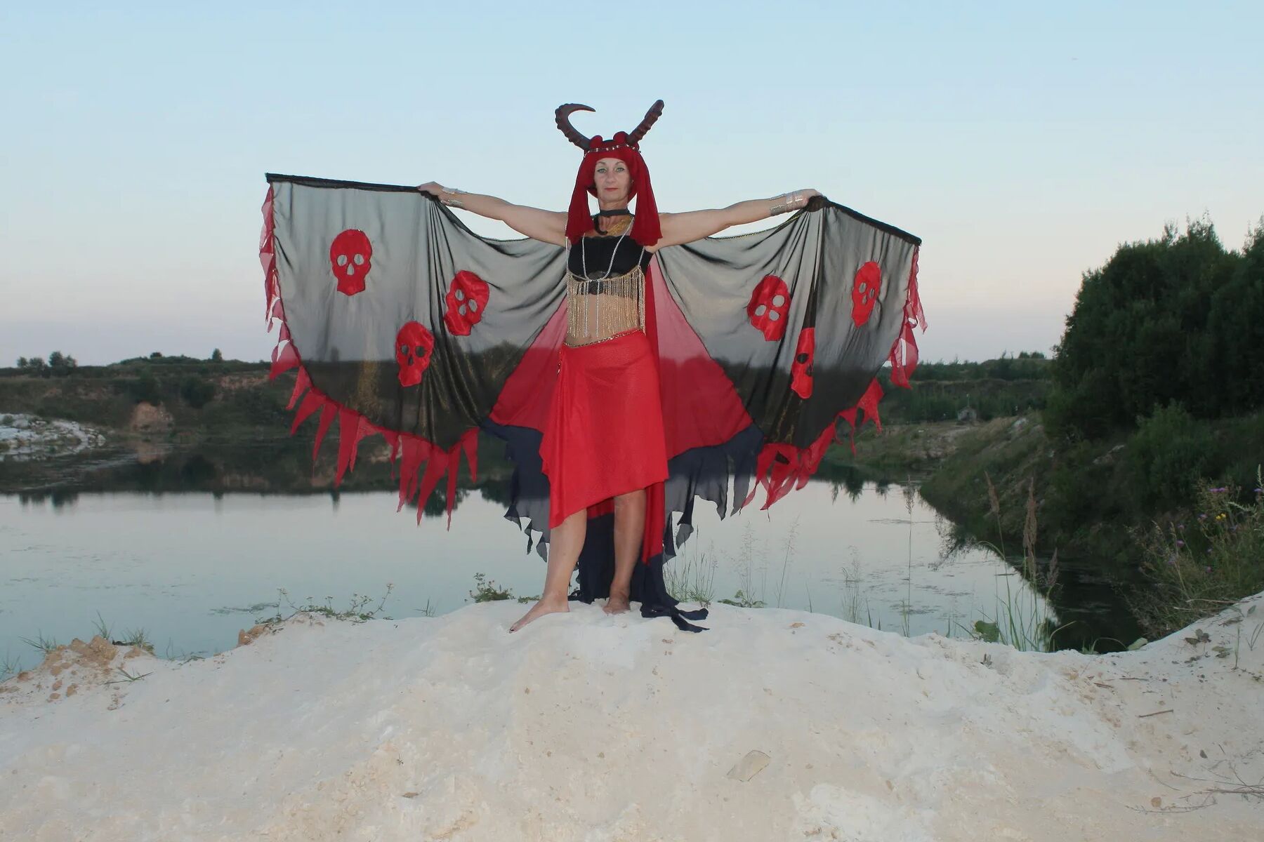 Witch over lake on sunset