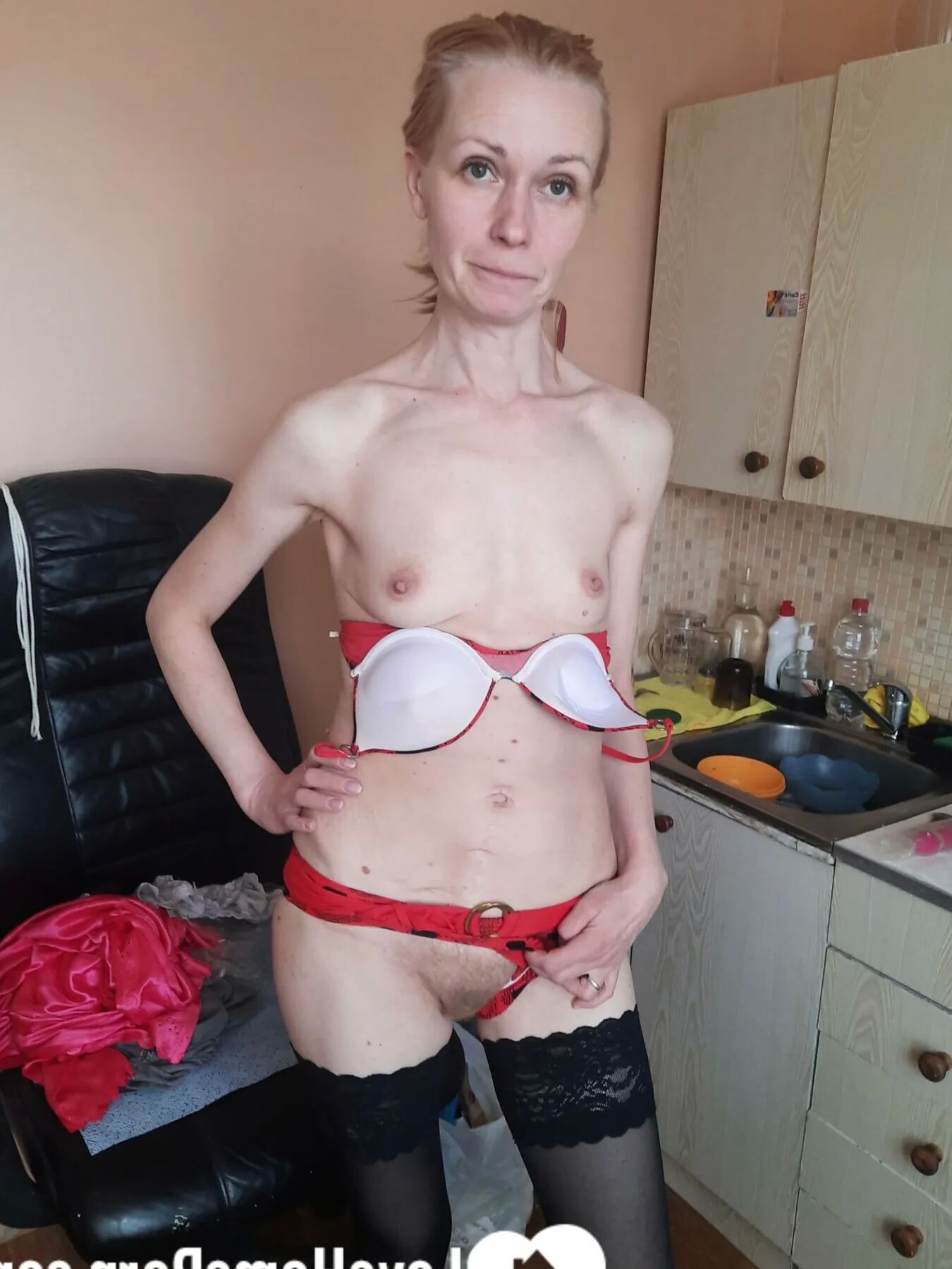 MILF in stockings fools around for a bit