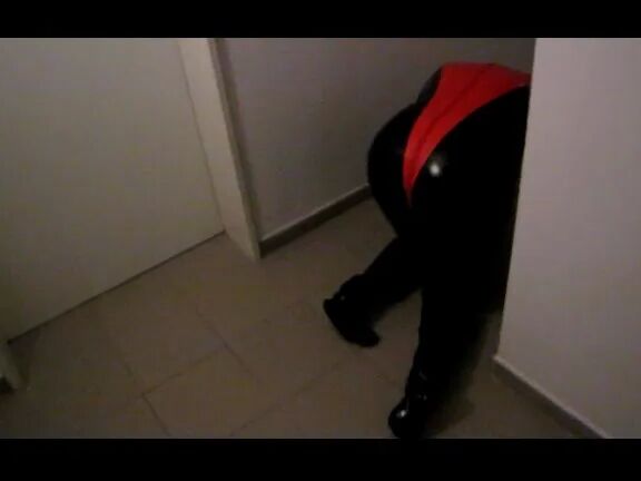 Petplay in latex suit ...