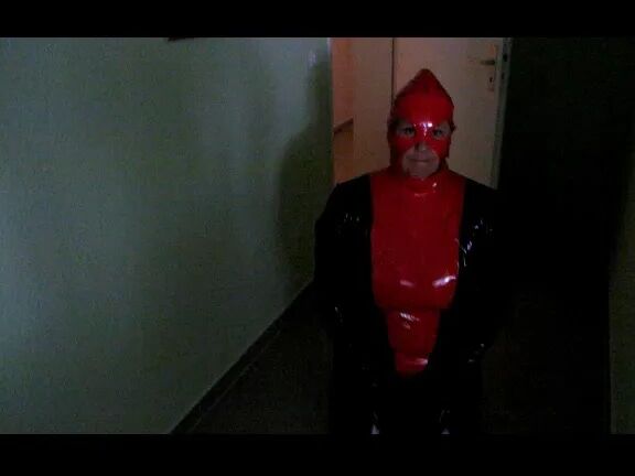 Petplay in latex suit ...