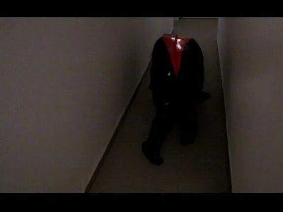 Petplay in latex suit ...