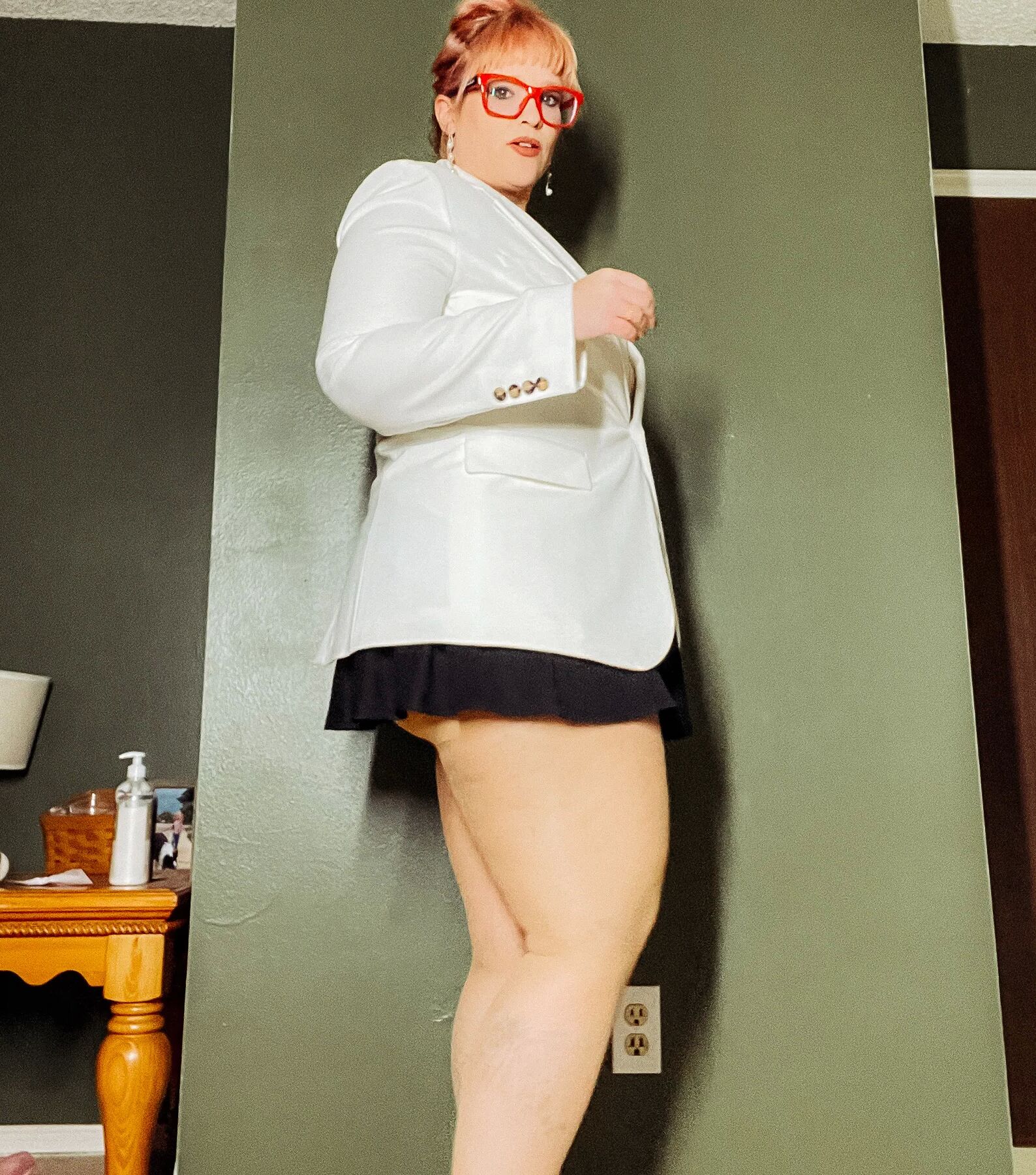 BBW in a mini black skirt and nylons with heels Big Thighs