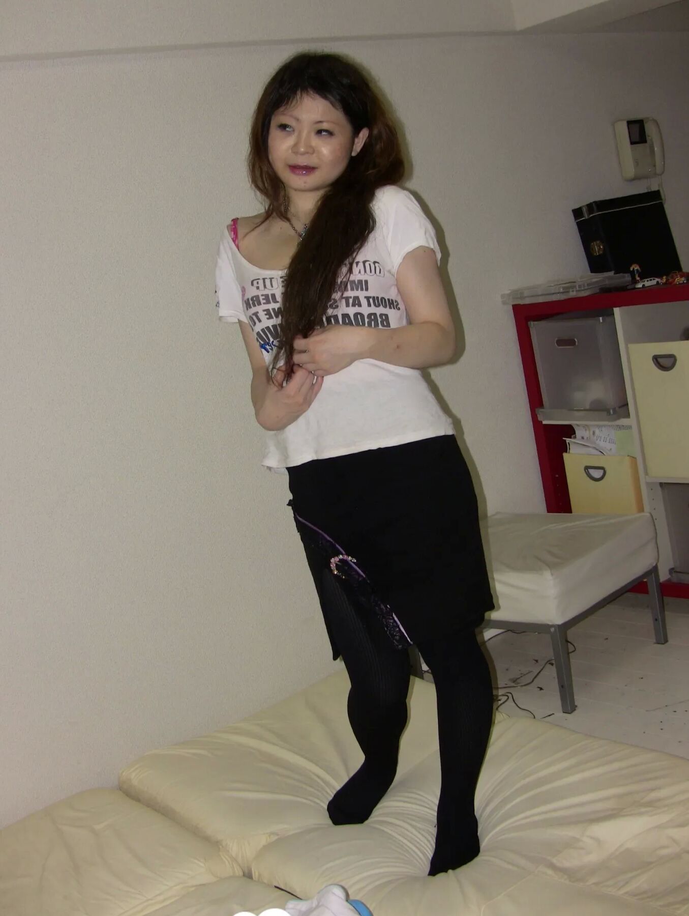 Stunning Asian gets completely naked on camera