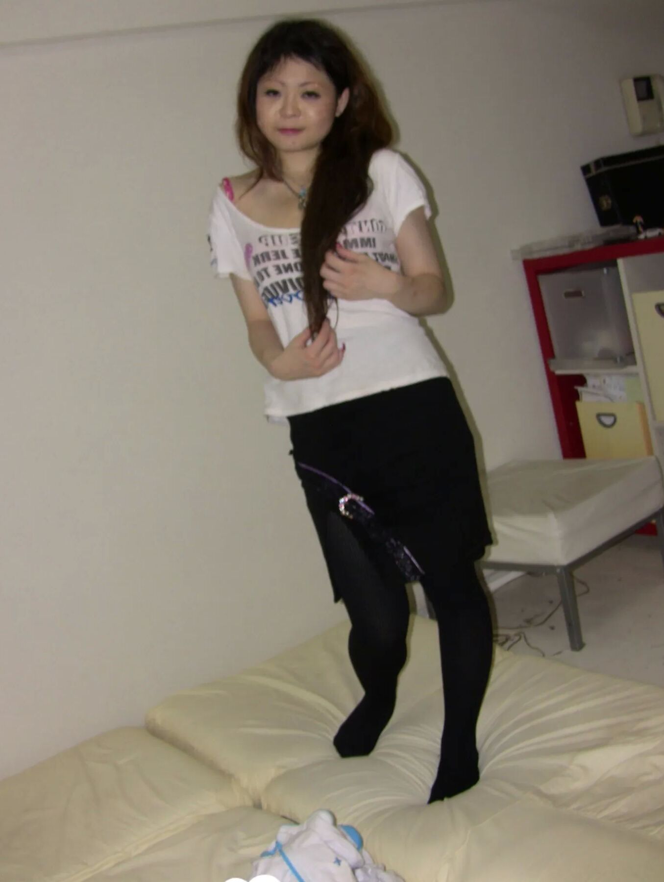 Stunning Asian gets completely naked on camera