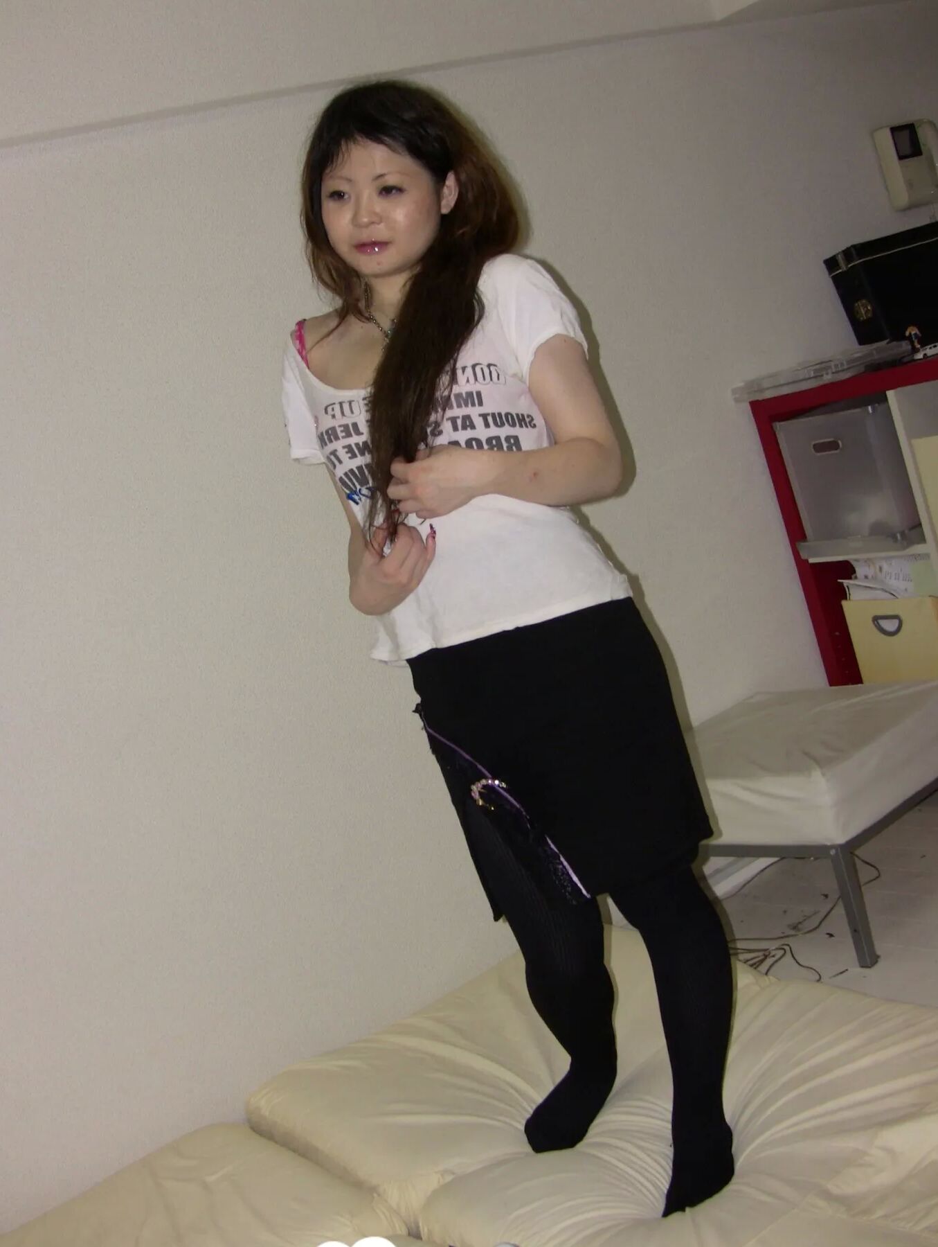 Stunning Asian gets completely naked on camera
